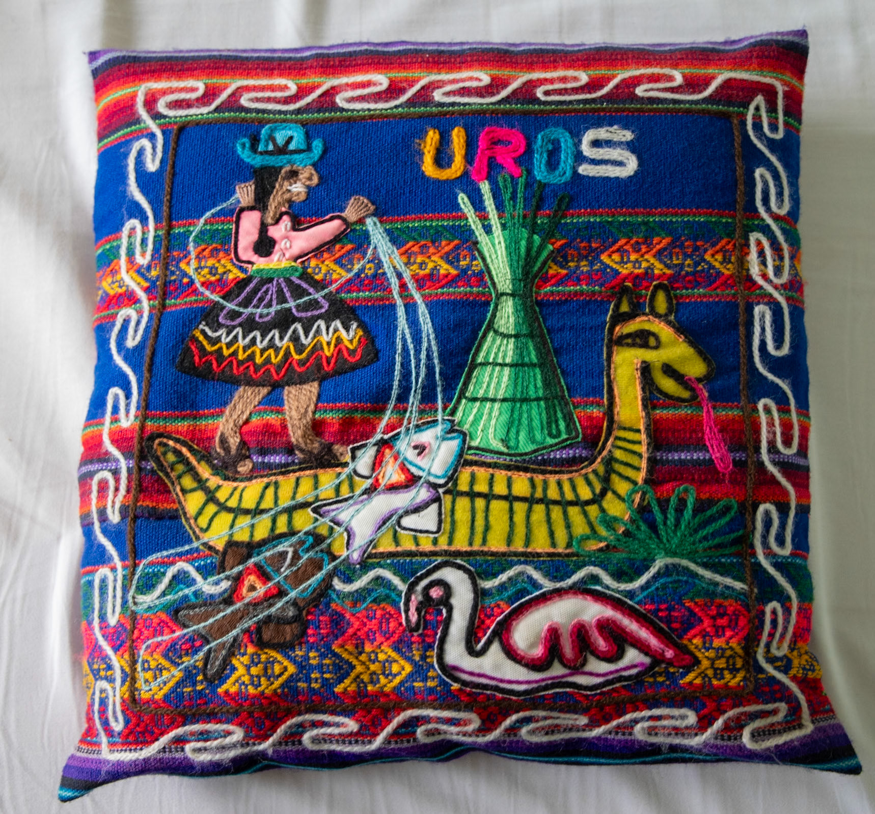 Handmade cushion cover depicting the life of the Uros people on Lake Titicaca
