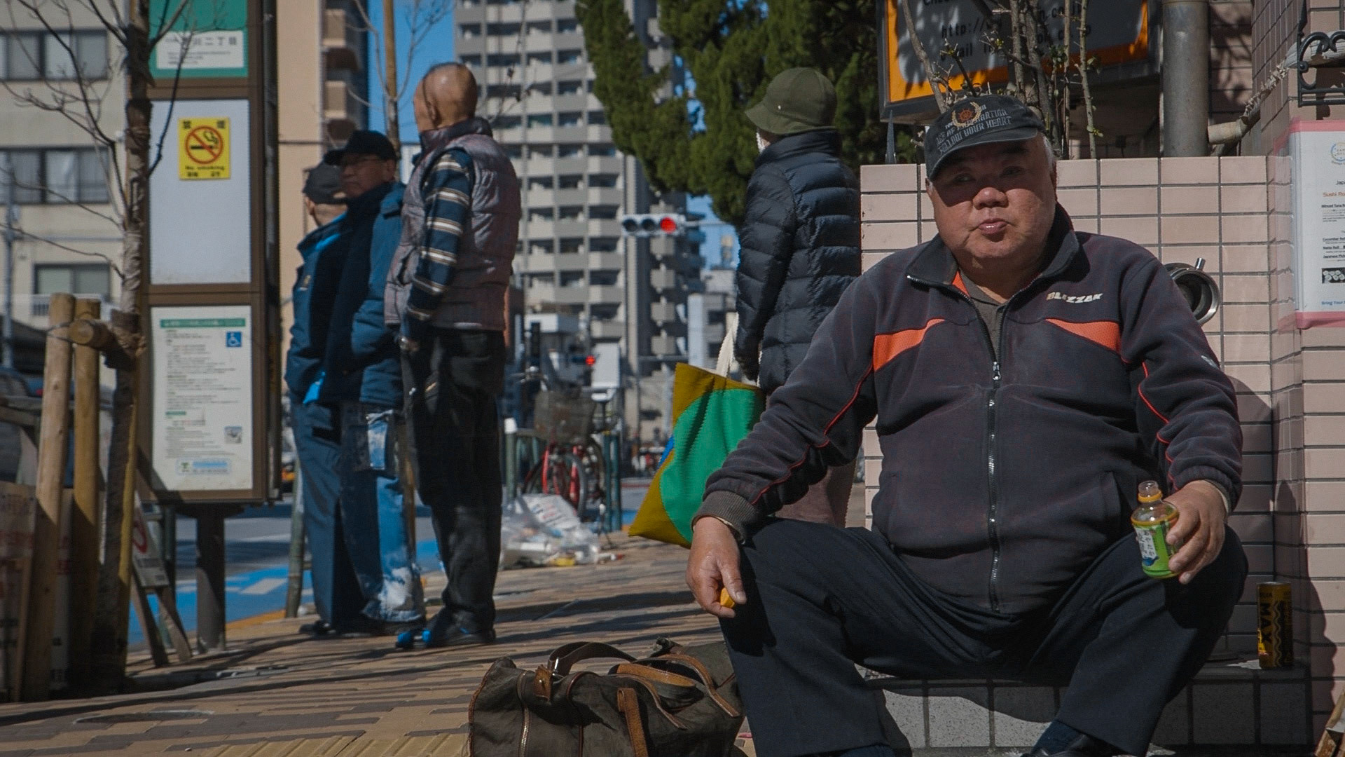 Harmonica 9 | A man giving a coffee firstly refused Ishino's passionate request for cigarettes, saying "I can't afford them!!" and left, but came back soon with a can of coffee and gave it to Ishino, saying "but I have only this for you", grnning, 10 April 2020.