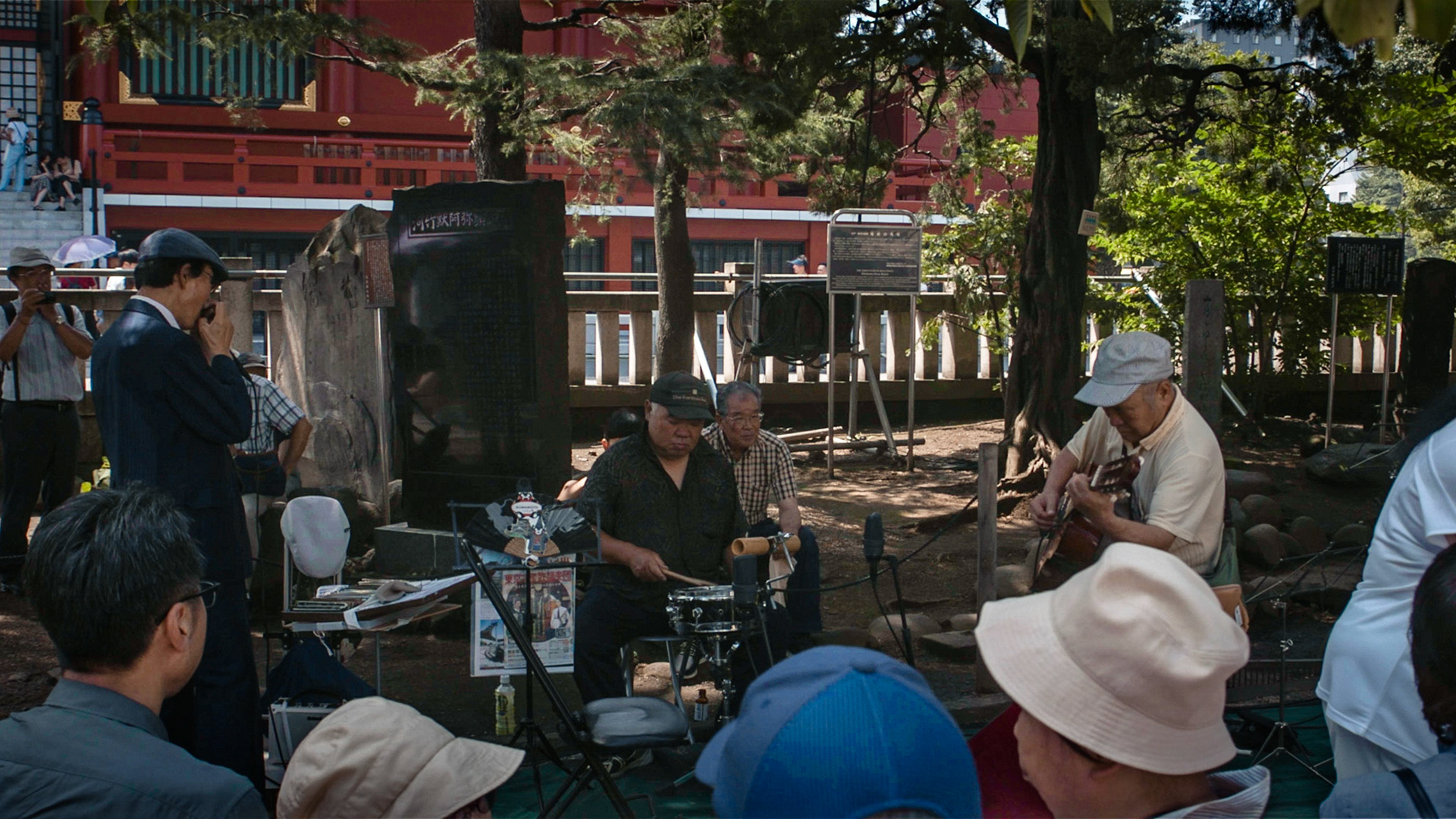Harmonica 3 | Ishino carefully tuning the drum before the stage, tries not to care of a crowd of curious onlookers and expected audiences gathering before him, 29 July 2019.