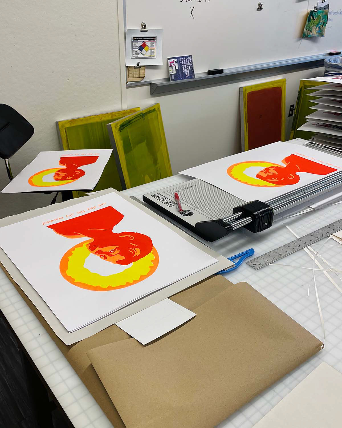 Prints in process of being cut to size