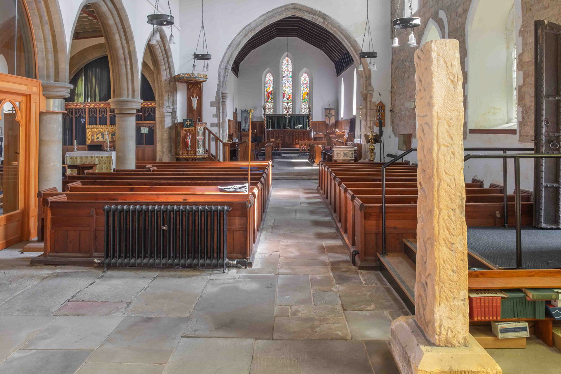 The Crowle Stone and the Church interior looking East - St. Oswald's Church Crowle Lincolnshire UK 2025