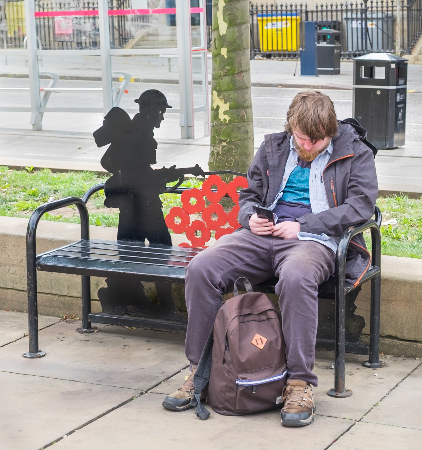 Man Sat at War Memorial - The Headrow Leeds UK