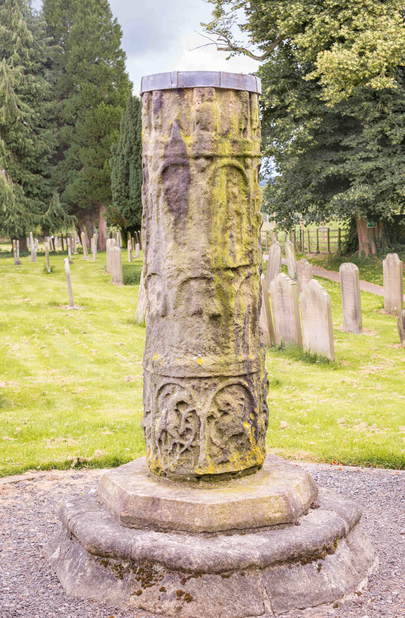 Ancient Cross remains viewed from church doors - St Mary's Church  Masham North Yorkshire UK 2024