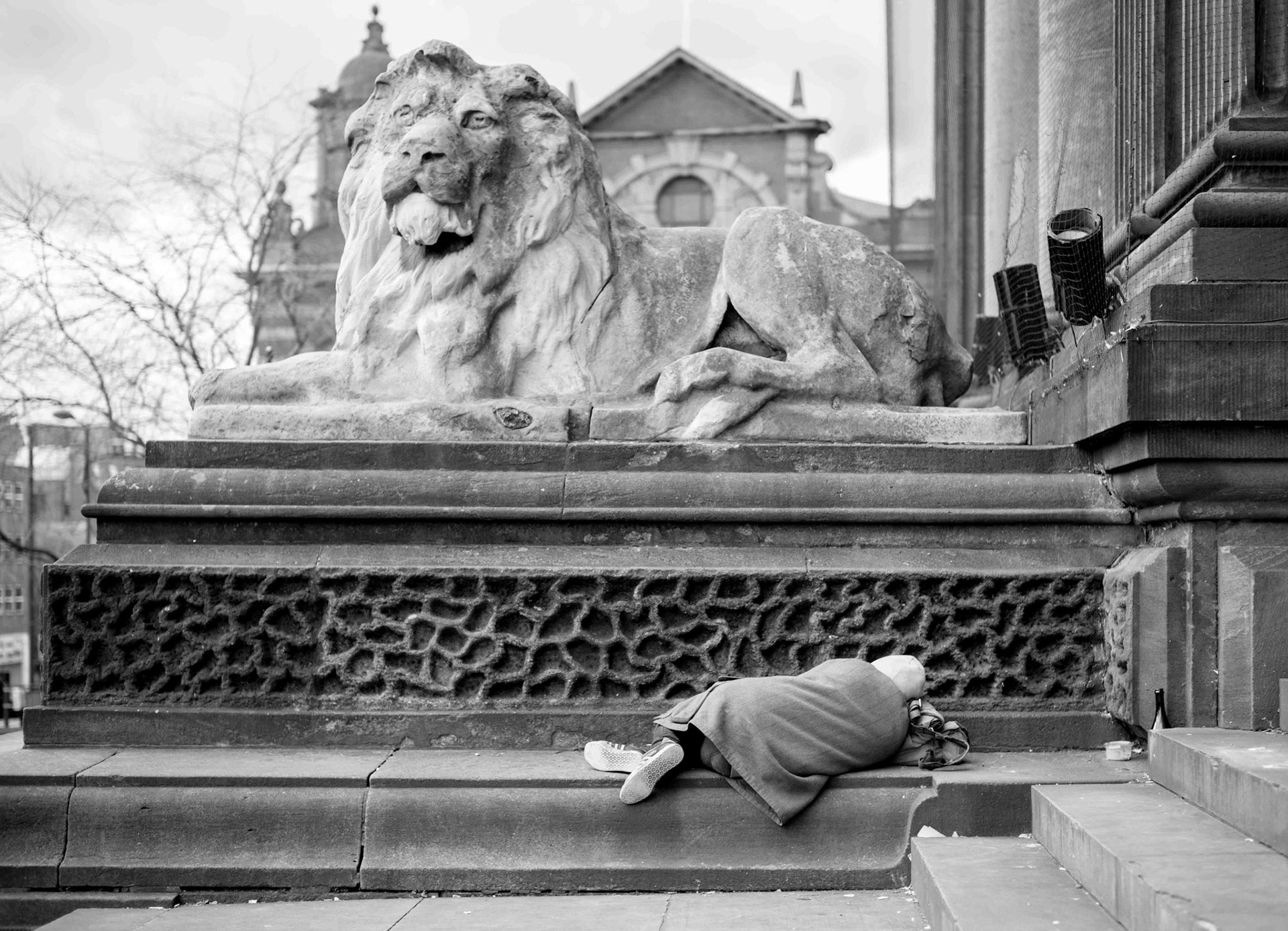 Man Asleep near Lion - Leeds West Yorkshire UK