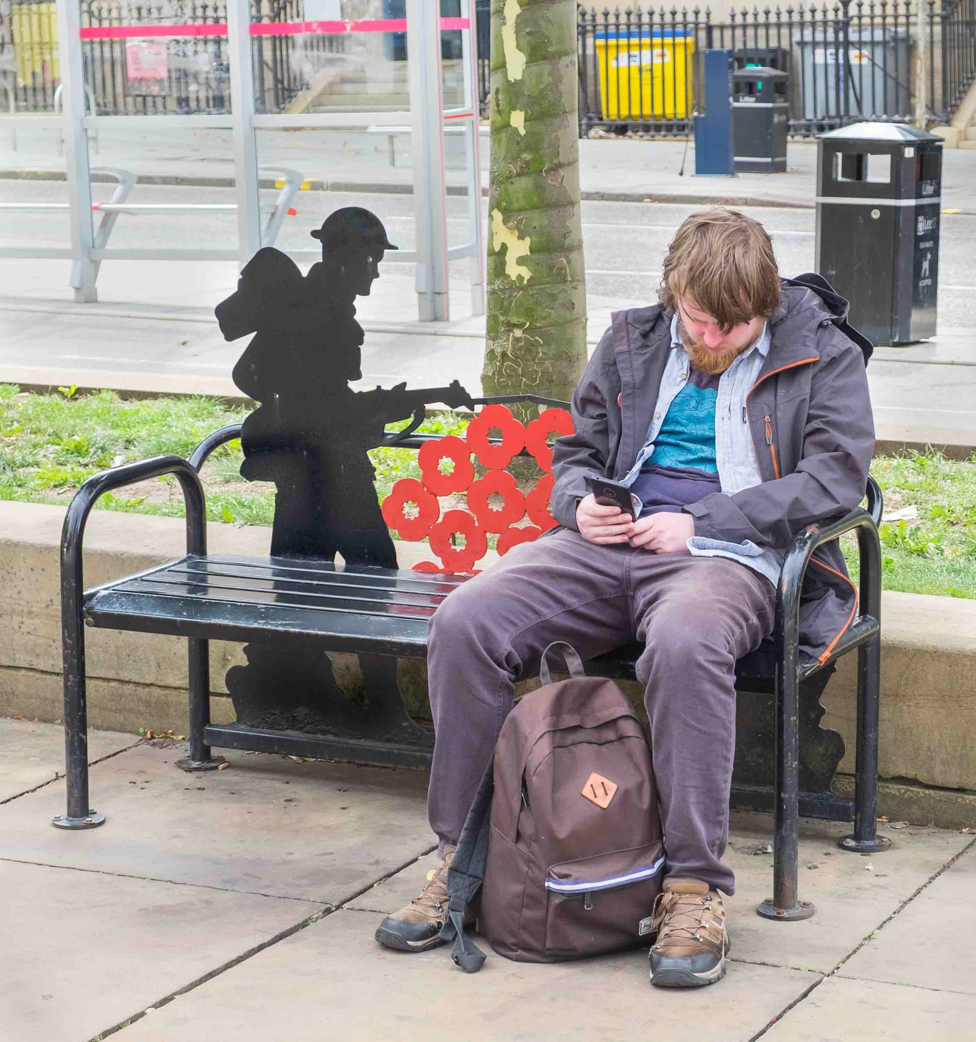Man Sat at War Memorial - The Headrow Leeds UK