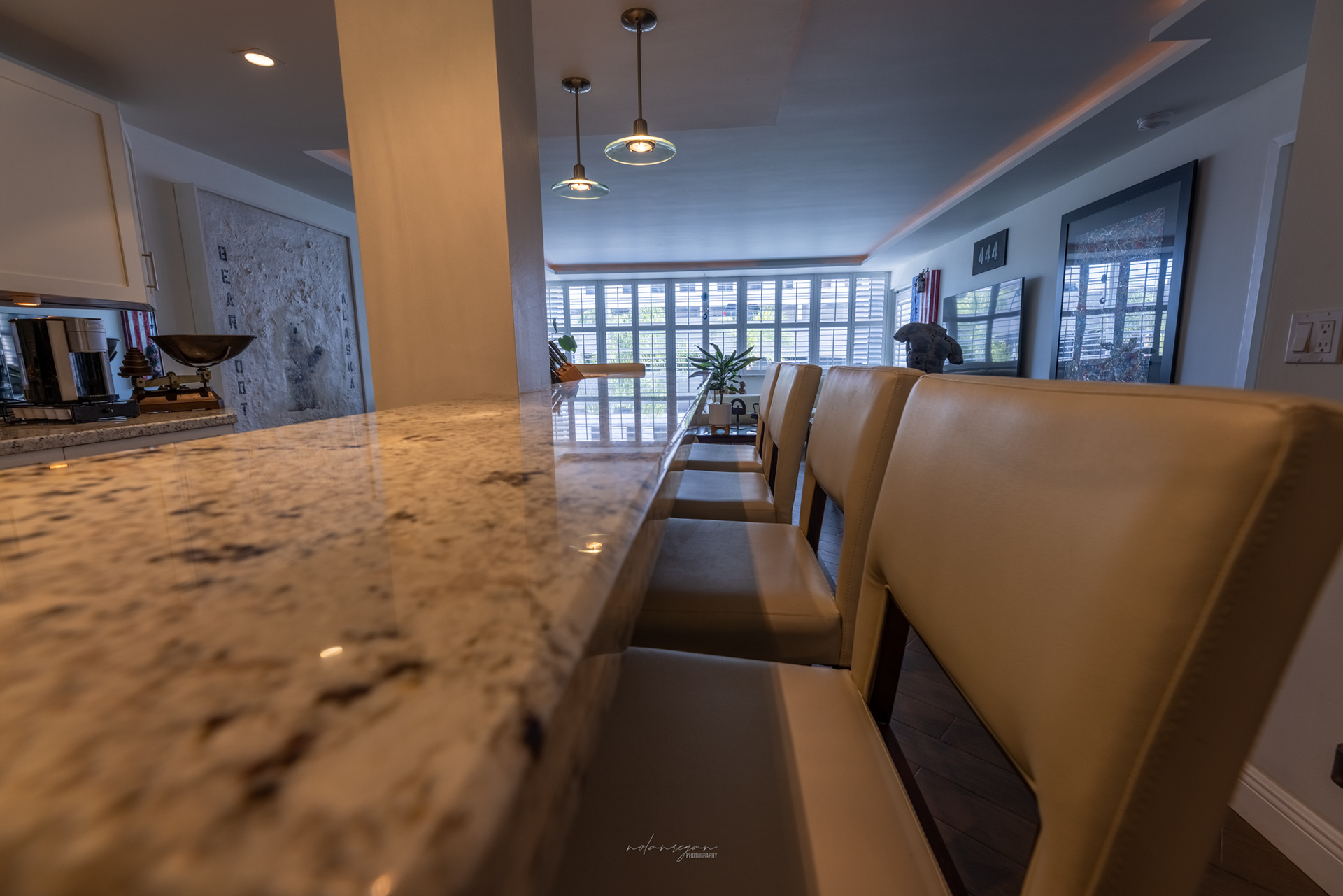 Kitchen island facing windows (highlighting bar stools)