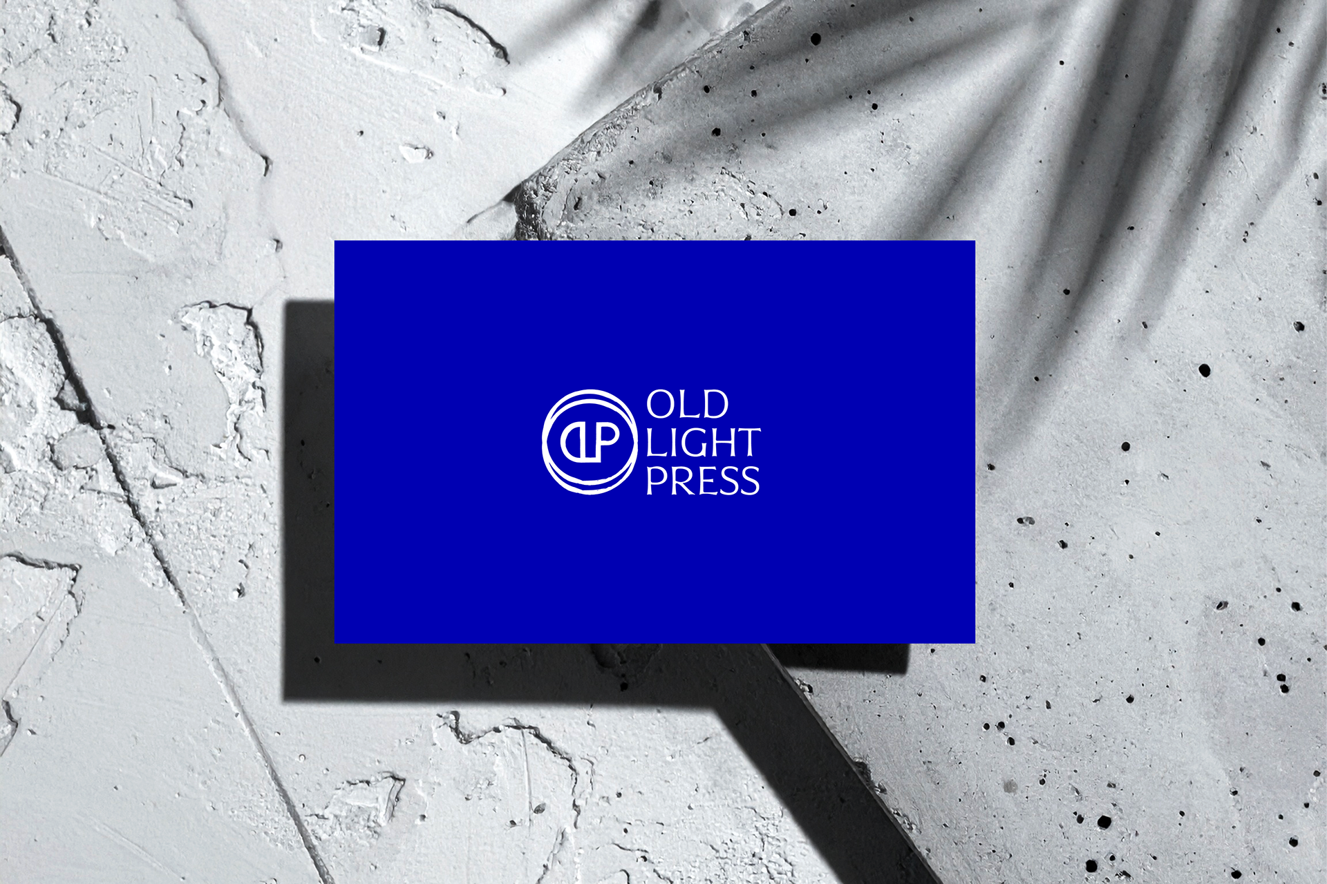 Blue business card design and branding mockup on raw concrete surface by Athens branding studio