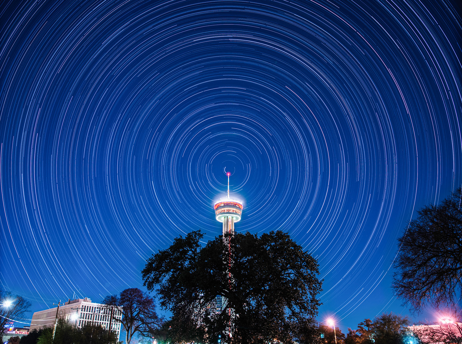 Star trails with red tower