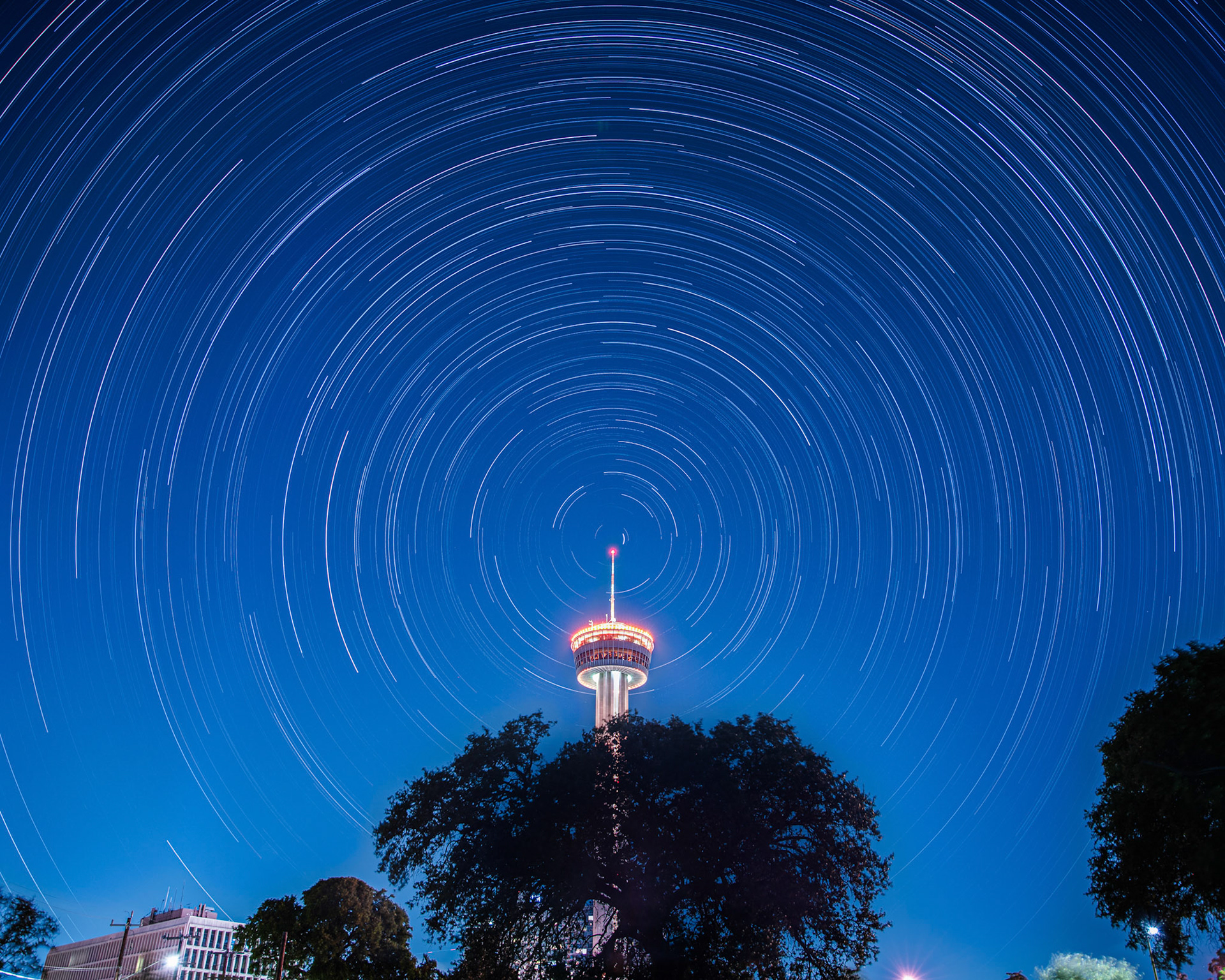 Star trails with orange tower