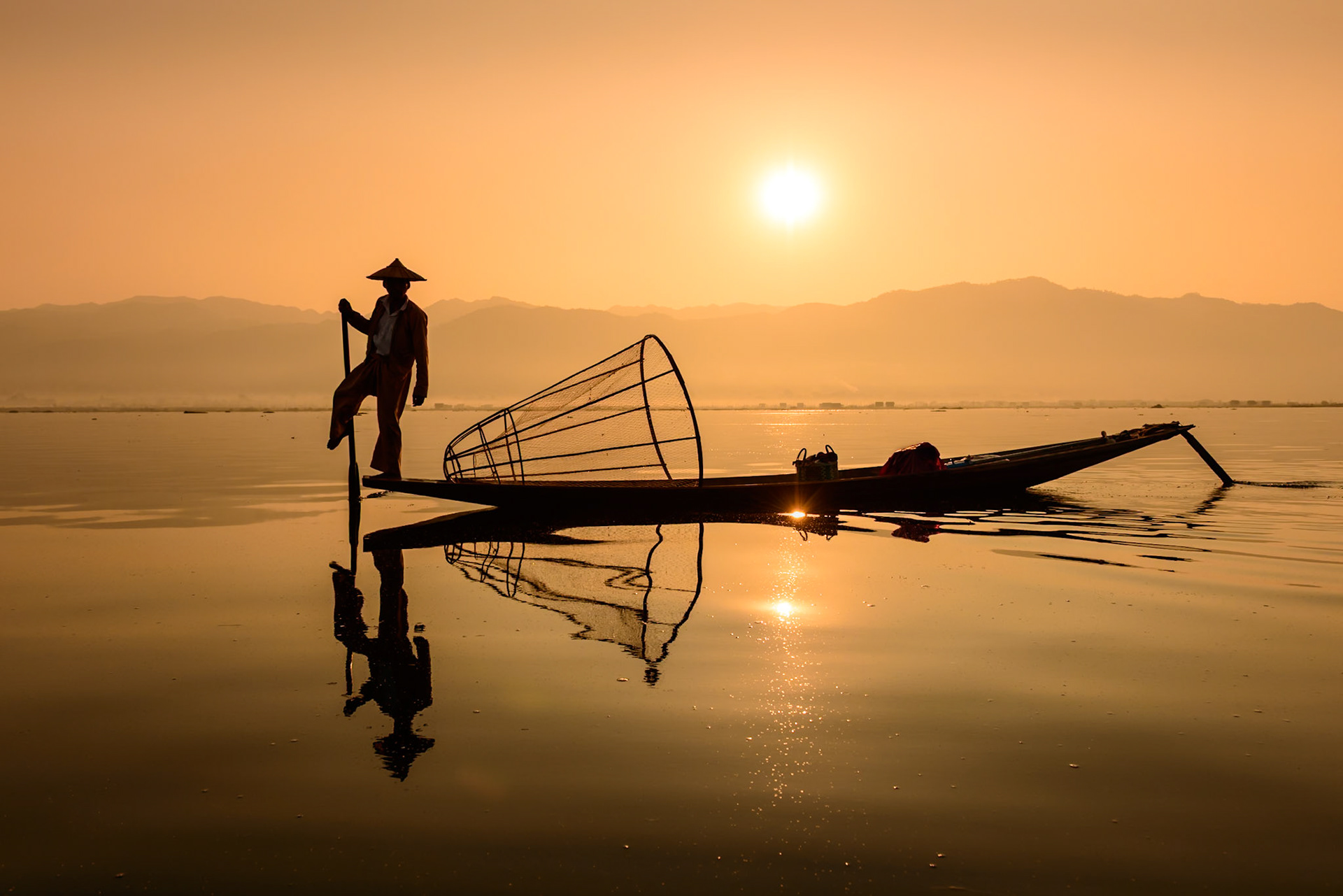 The light was perfect to capture this fisherman as he paddled slowly to his next stop in the stillness of the morning.(Copy to darken sihlouette) PCC-Feb'25, Theme 3nd, 24