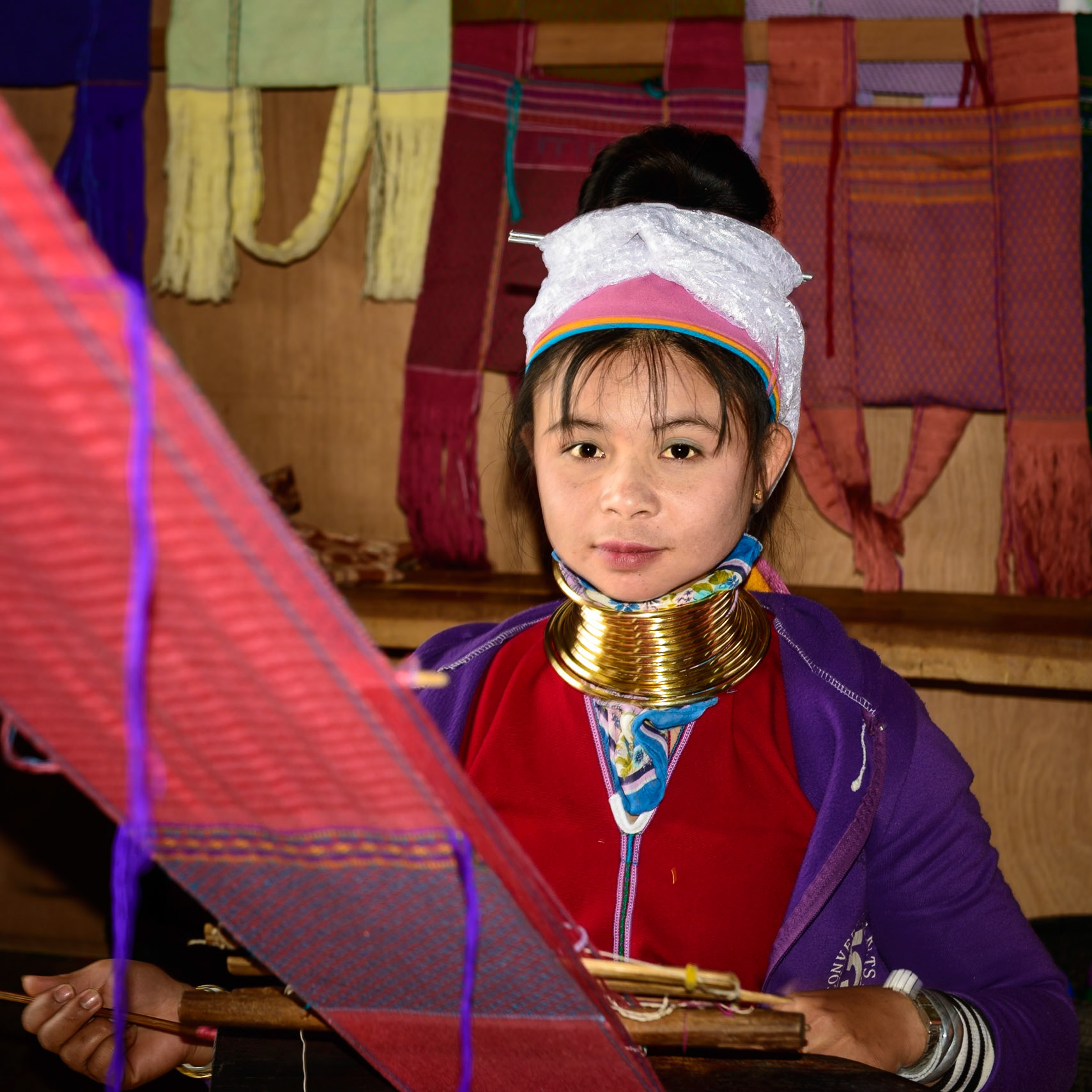 Young Traditional Kayan Weaver goes about her work.