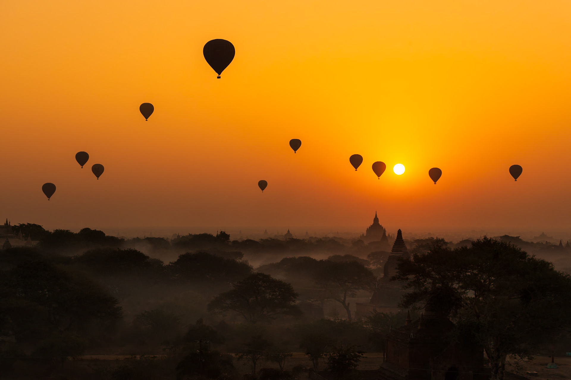 Reworked 3/25/19 - has not been printed or tested. Balloons over Bagan was captured during our recent trip to the Bagan region of Myanmar.The early morning light was a golden rose hue, and the balloons silhouetted over the temple spires created an awe inspiring scene.