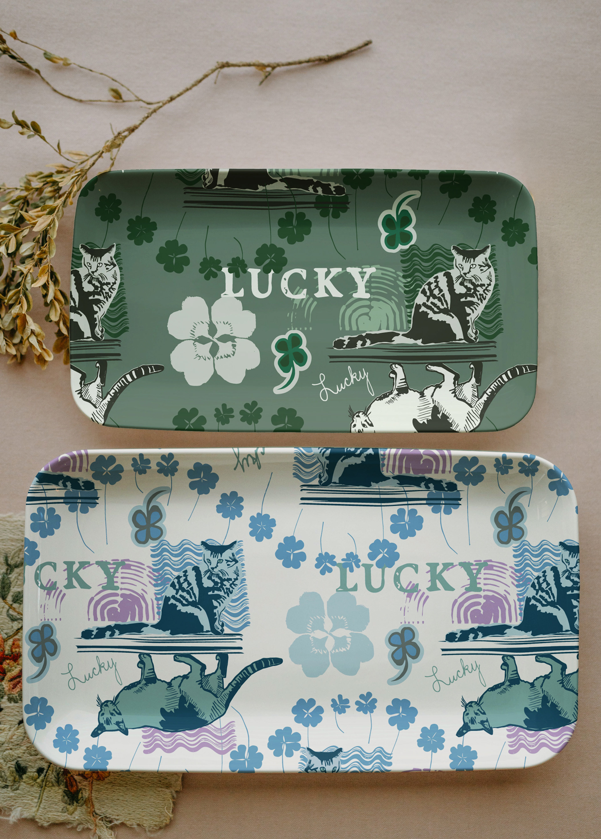 plastic trays with the Lucky Find hero print in both colors. Cats, clover, bold graphic.