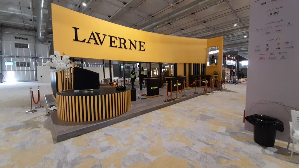 LAVERNE live booth showcasing sleek design and modern architecture on the left side, offering a unique space for interaction and engagement.