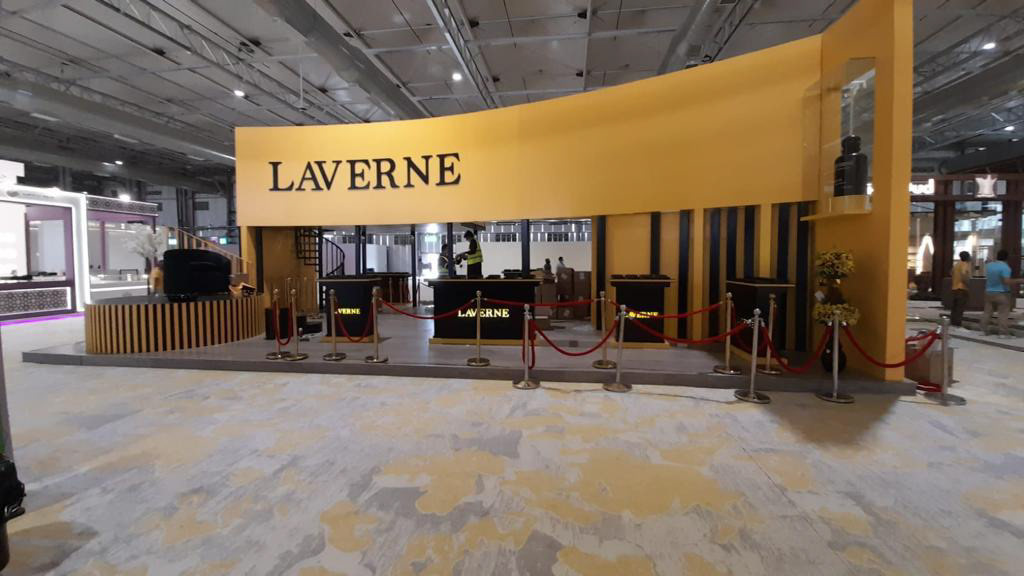 LAVERNE live booth featuring interactive elements, designed to create engaging experiences, with a modern architectural layout on the right side.