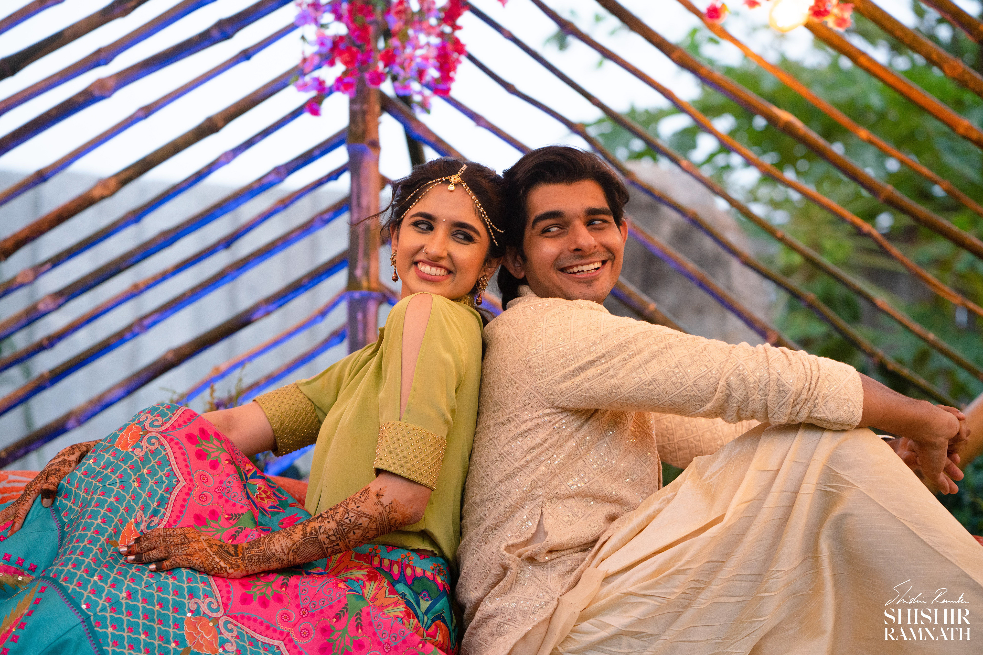 portrait of a couple with their backs against each other as wedding photograph