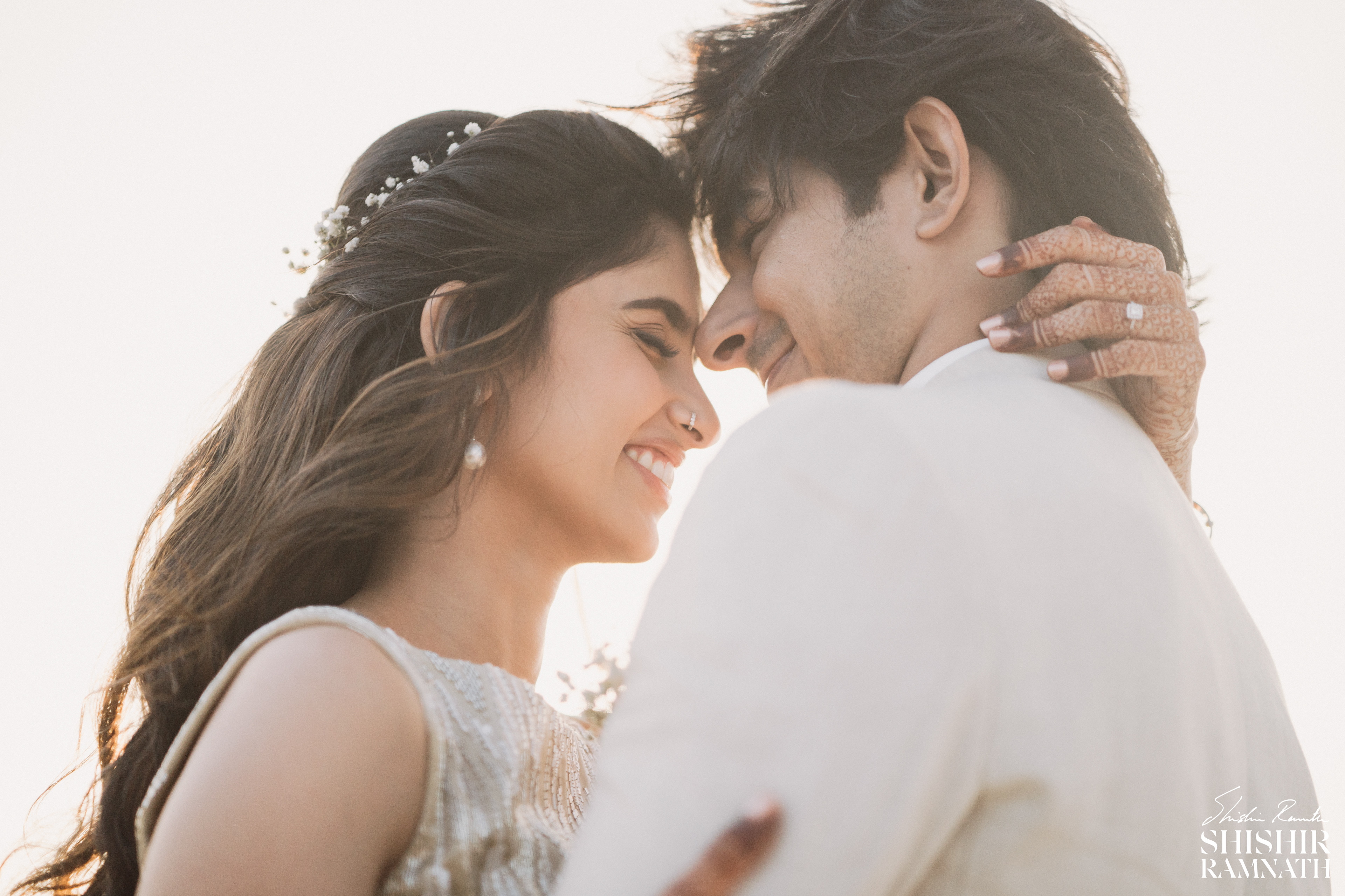 sunset portrait of a couple dancing on their wedding day