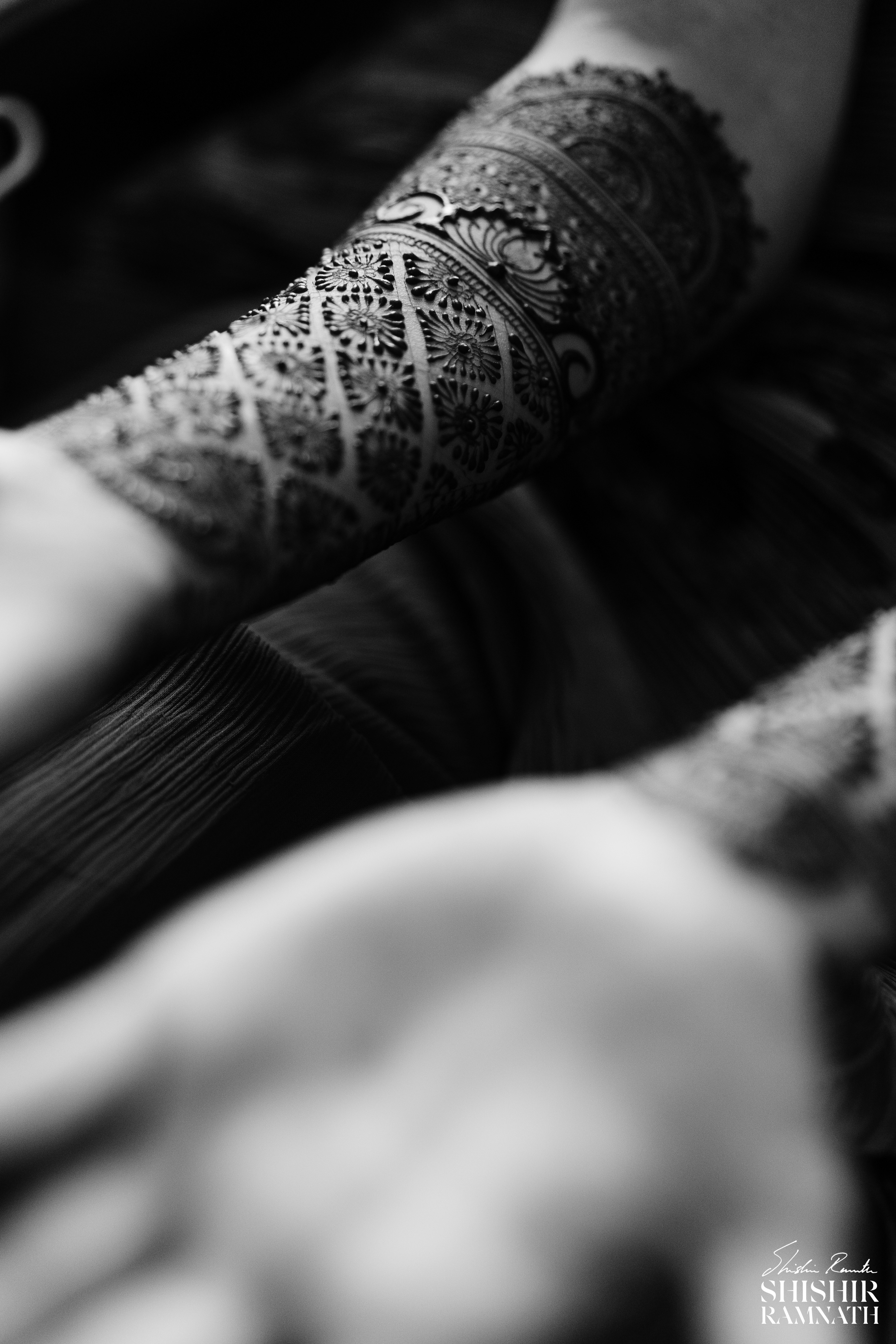 black and white image of bridal mehndi wth a sharp focus on the details