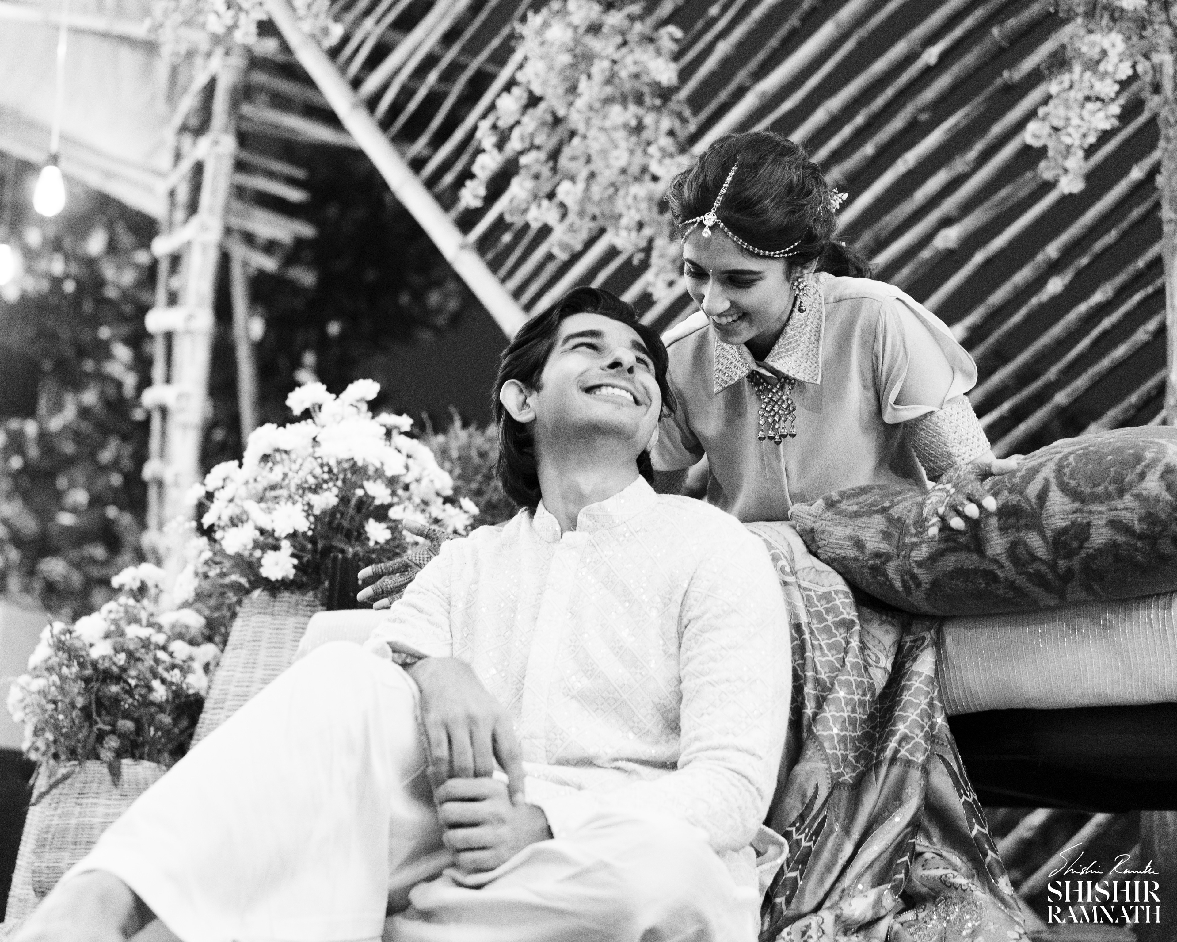 low angle of a couple looking at each other in black and white