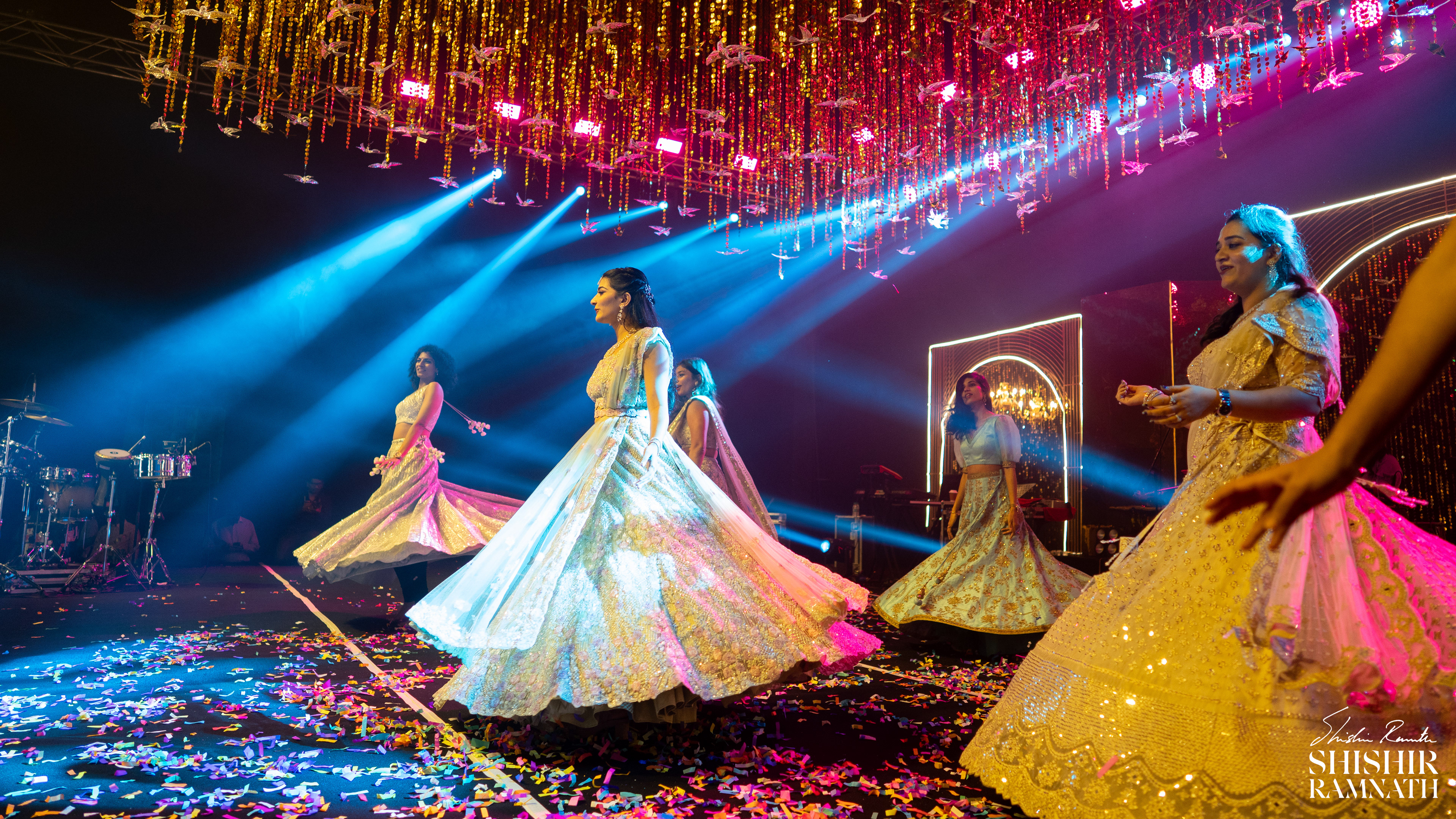 bridesmaids showing off their lehenga while dancing and setting bridal goals