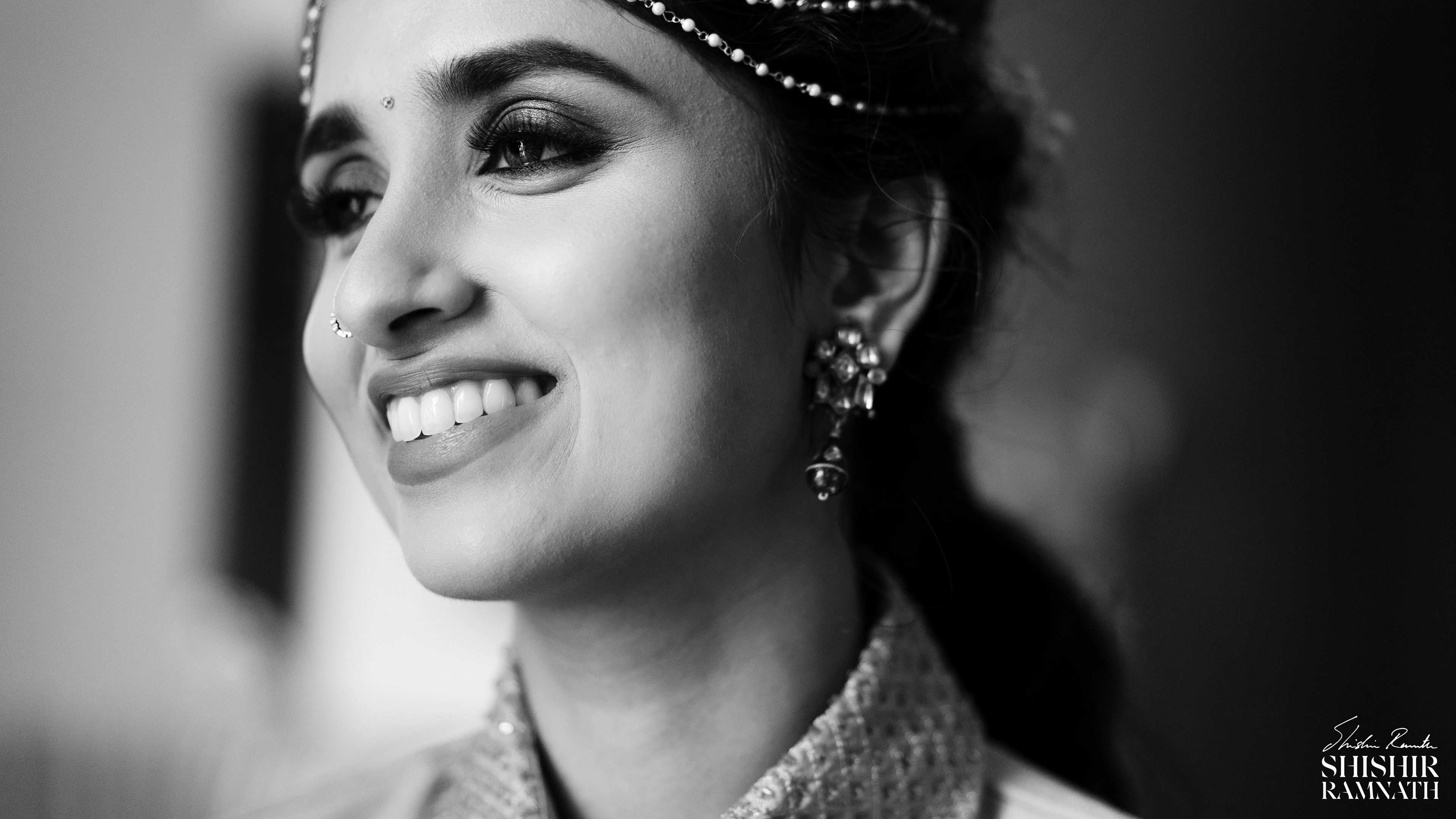 black and white poto pf an indian bride with her eyes in focus