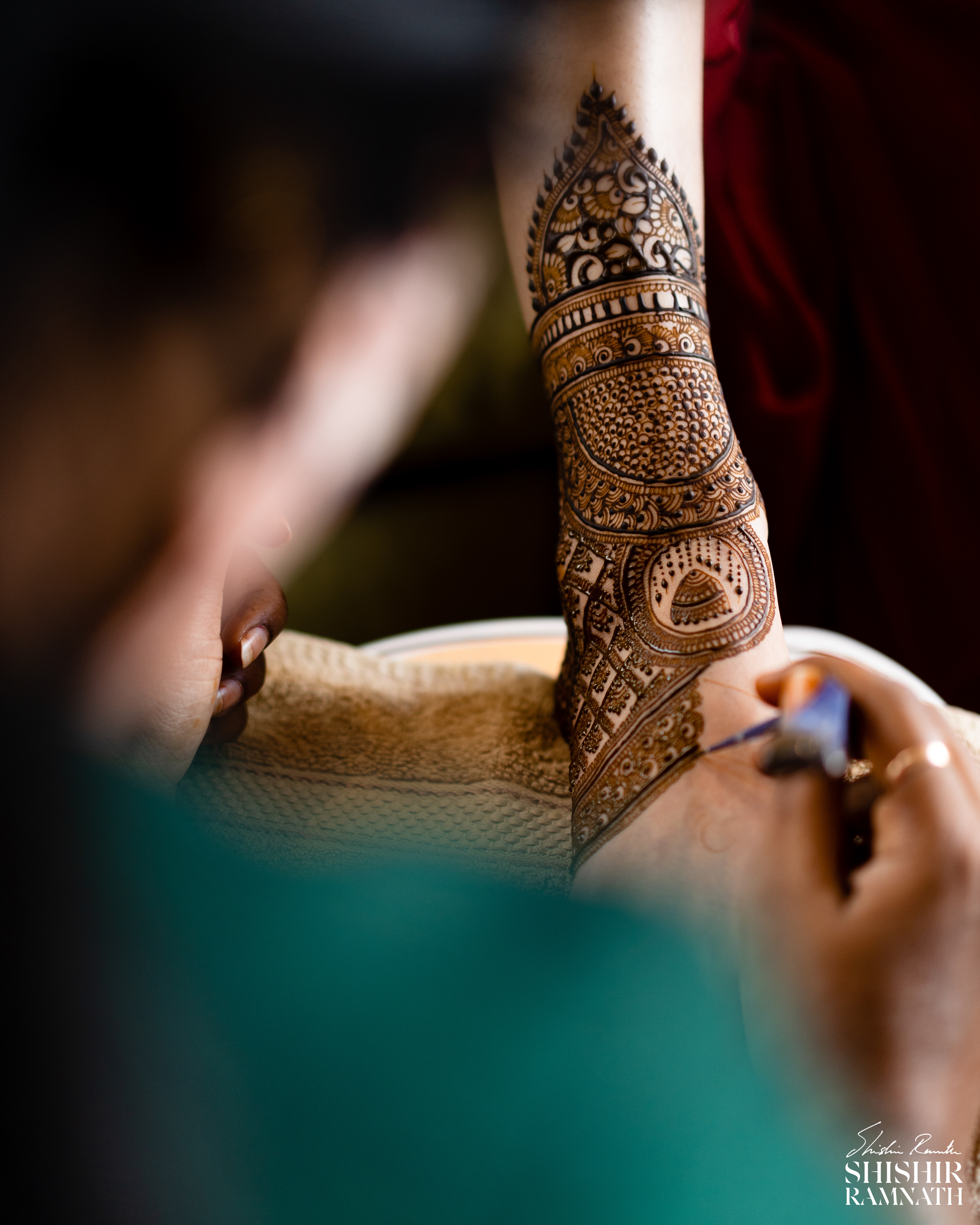 intricate mehndi design on a bride's feet