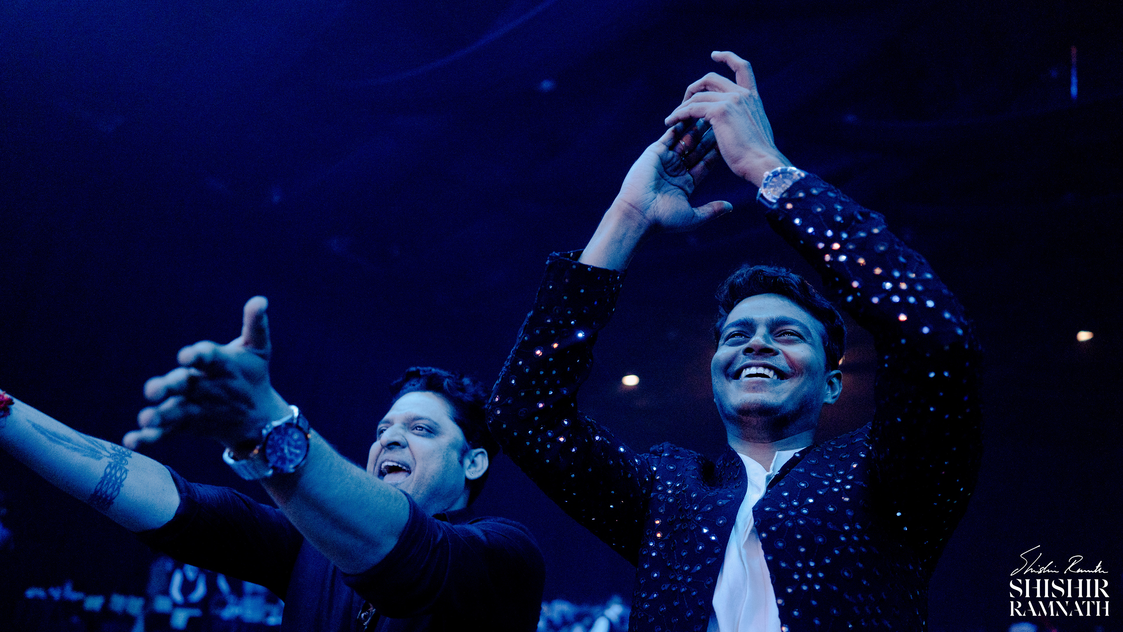 crowd cheering on the dancers at a destination wedding