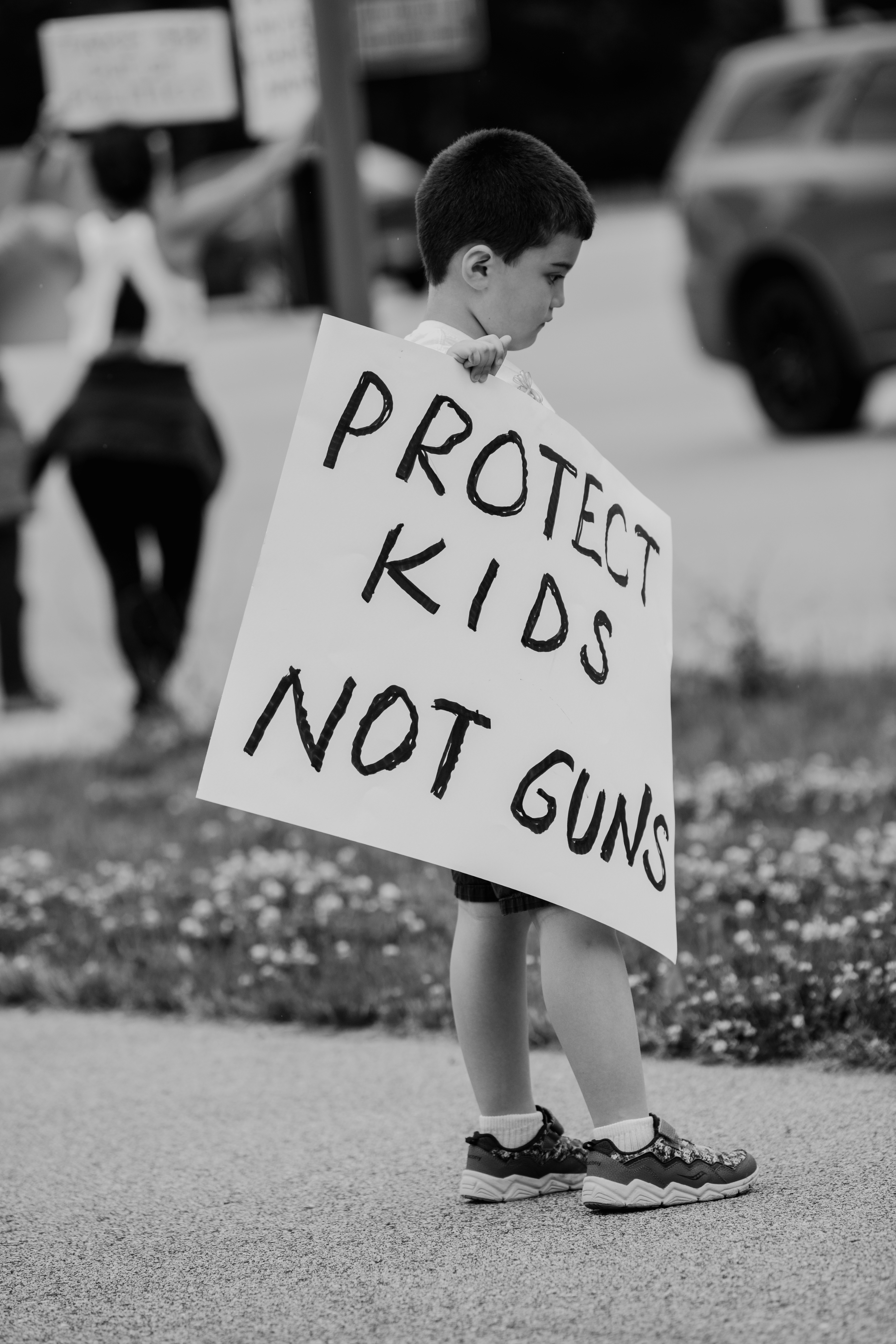 A child pays his respects and mourns for those lost in light of the mass shooting at Robb Elementary School, in Uvalde, Texas, which left two teachers and 19 students dead. 