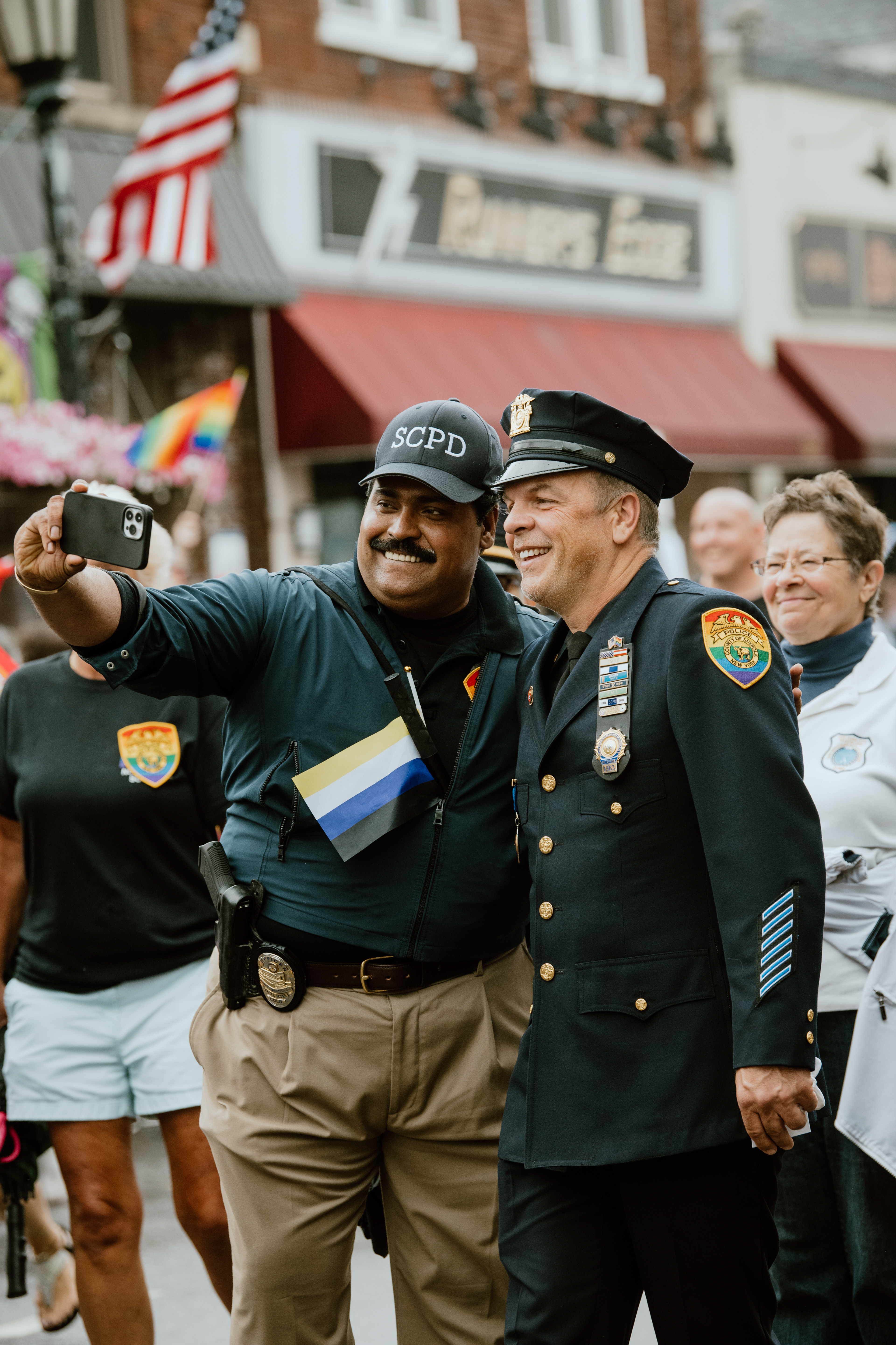 Two Officers from The Suffolk County Police Department pose for a selfie during the Long Island Pride Parade held in Farmingdale, NY on June 12, 2022. 