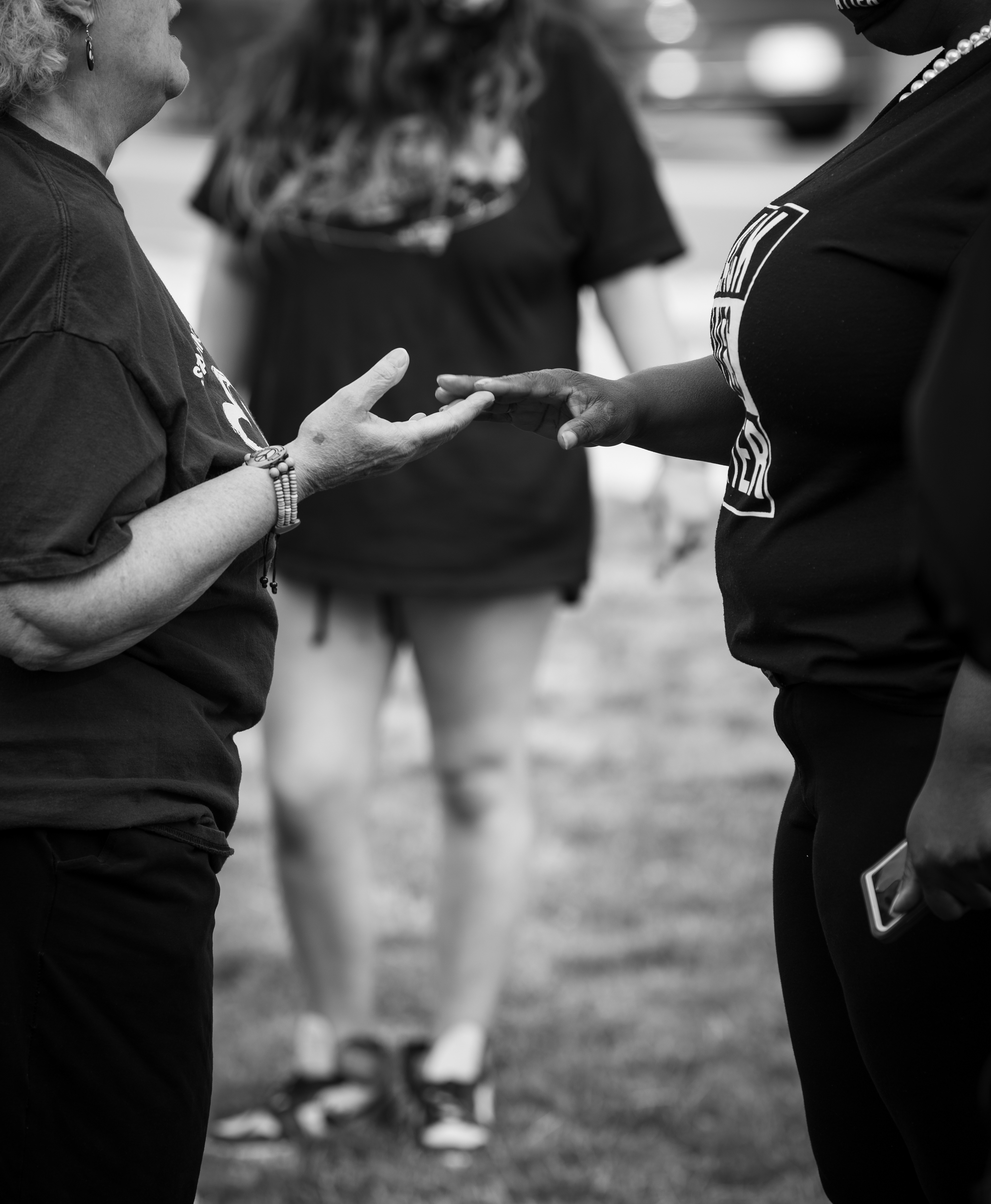 NAACP Huntington Branch President Veronique Bailey (right) expresses her grief alongside another attendee at a commemorative ceremony held in Huntington, NY, on the one-year anniversary of George Floyd’s death.