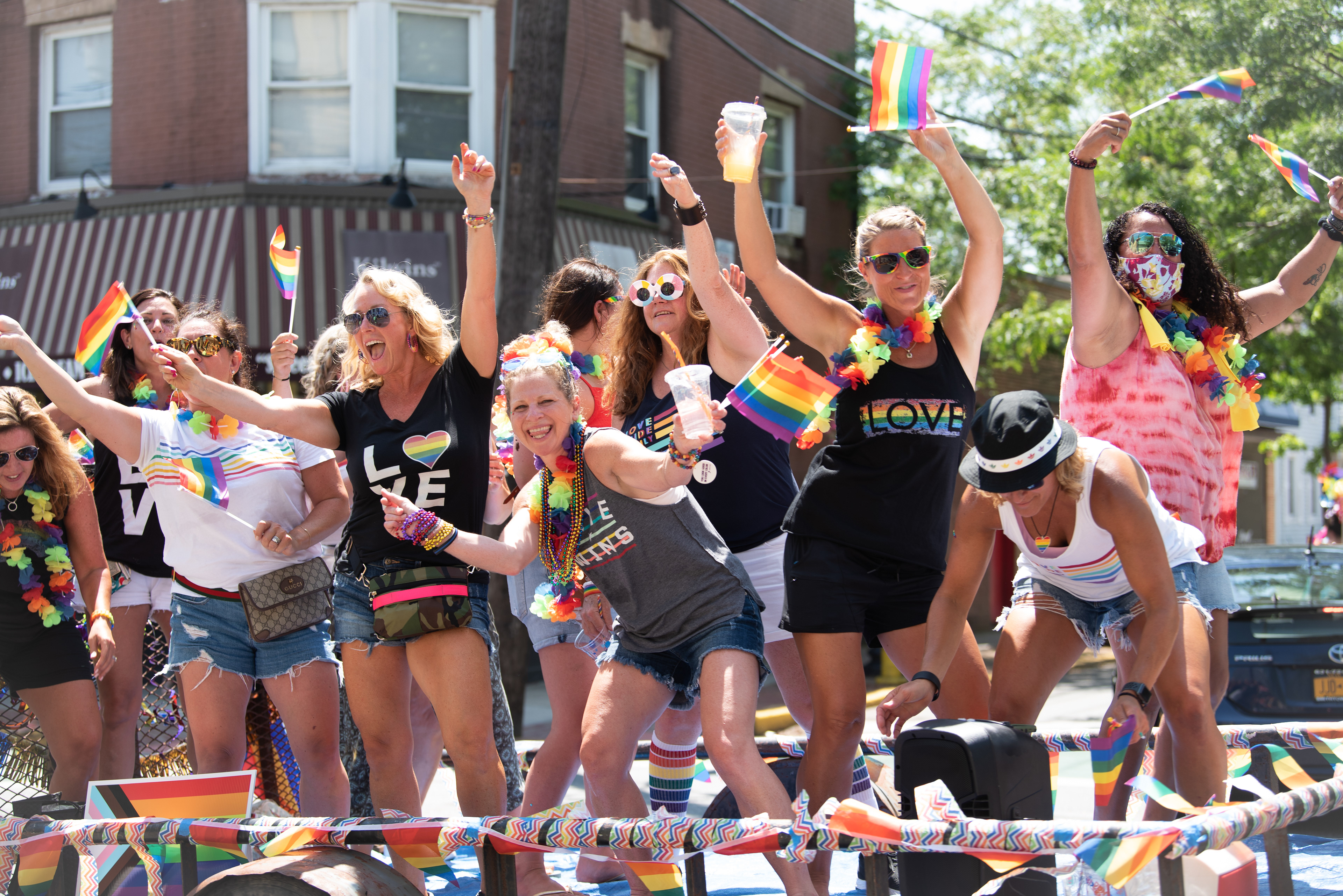 A group of women are pictured here celebrating atop a float adorned with rainbow decorations in celebration of Babylon’s Pride Parade which took place on June 28, 2020.
