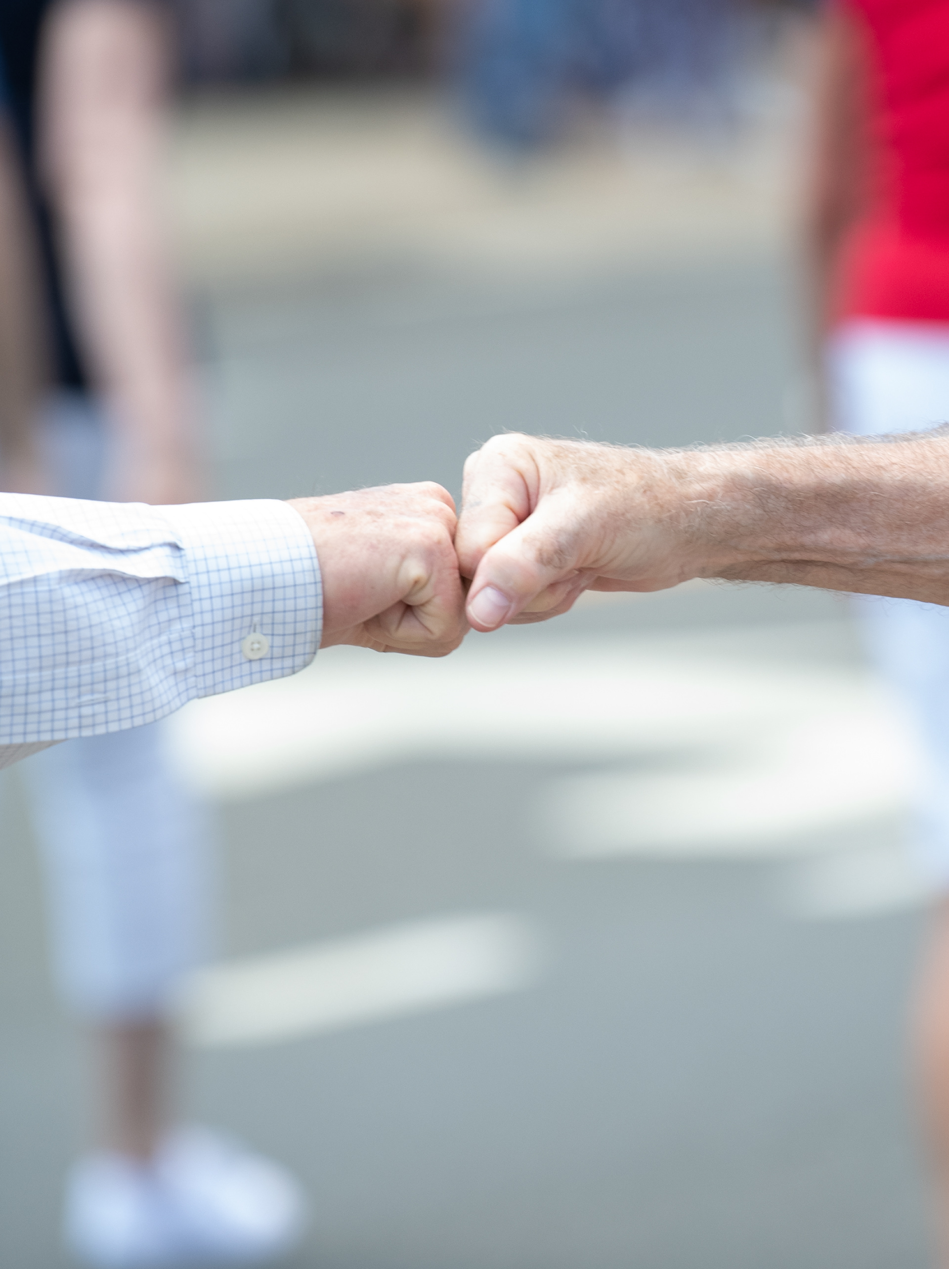 Two Veterans share a fist bump as a sign of mutual respect during Smithtown's Memorial Day Parade held on May 31, 2022.