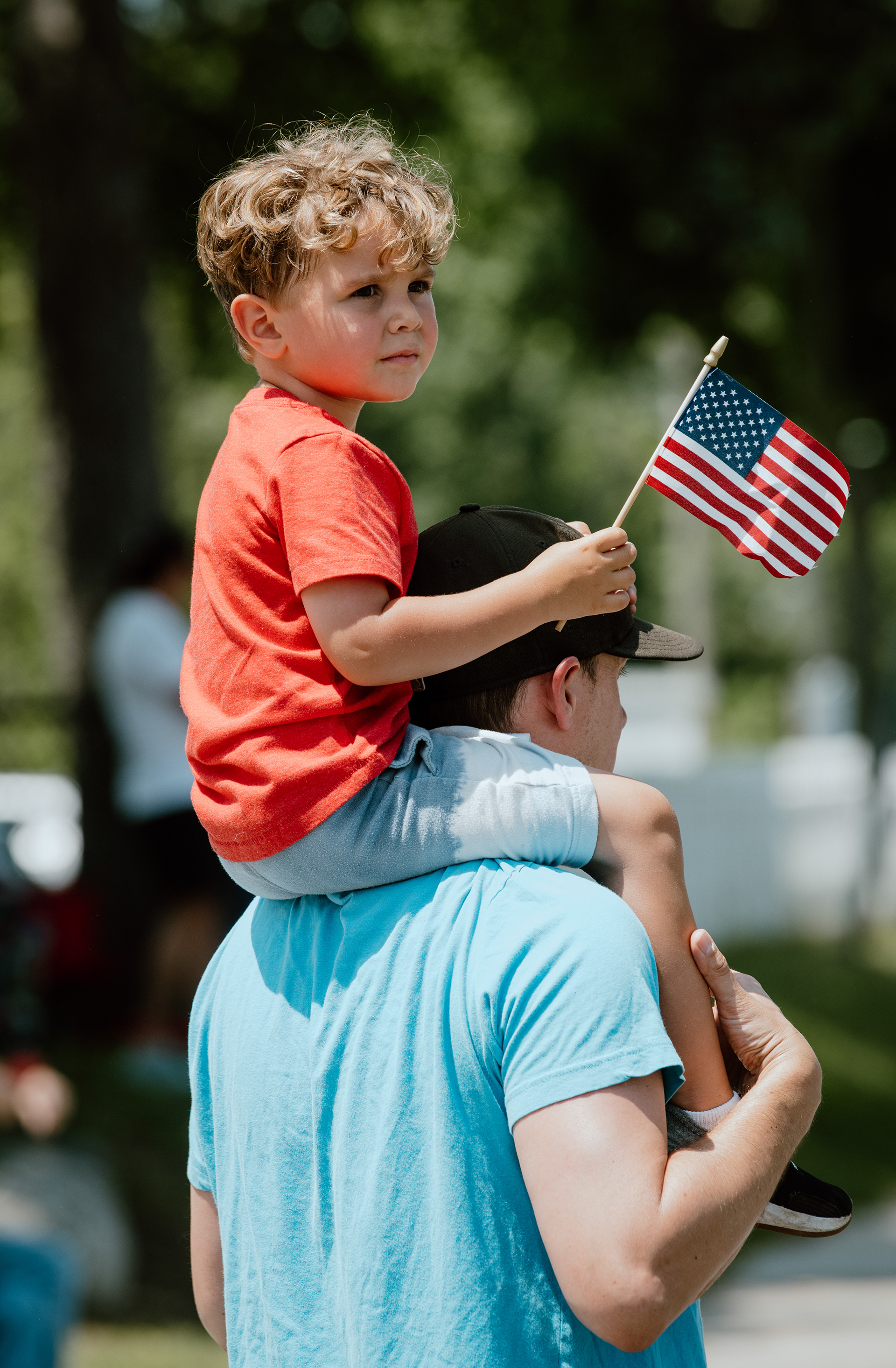 Greg Vignoli and his son, Gavin, cheer on veterans and servicemen and women alike as they made their way down Main Street during Smithtown's Memorial Day Parade.