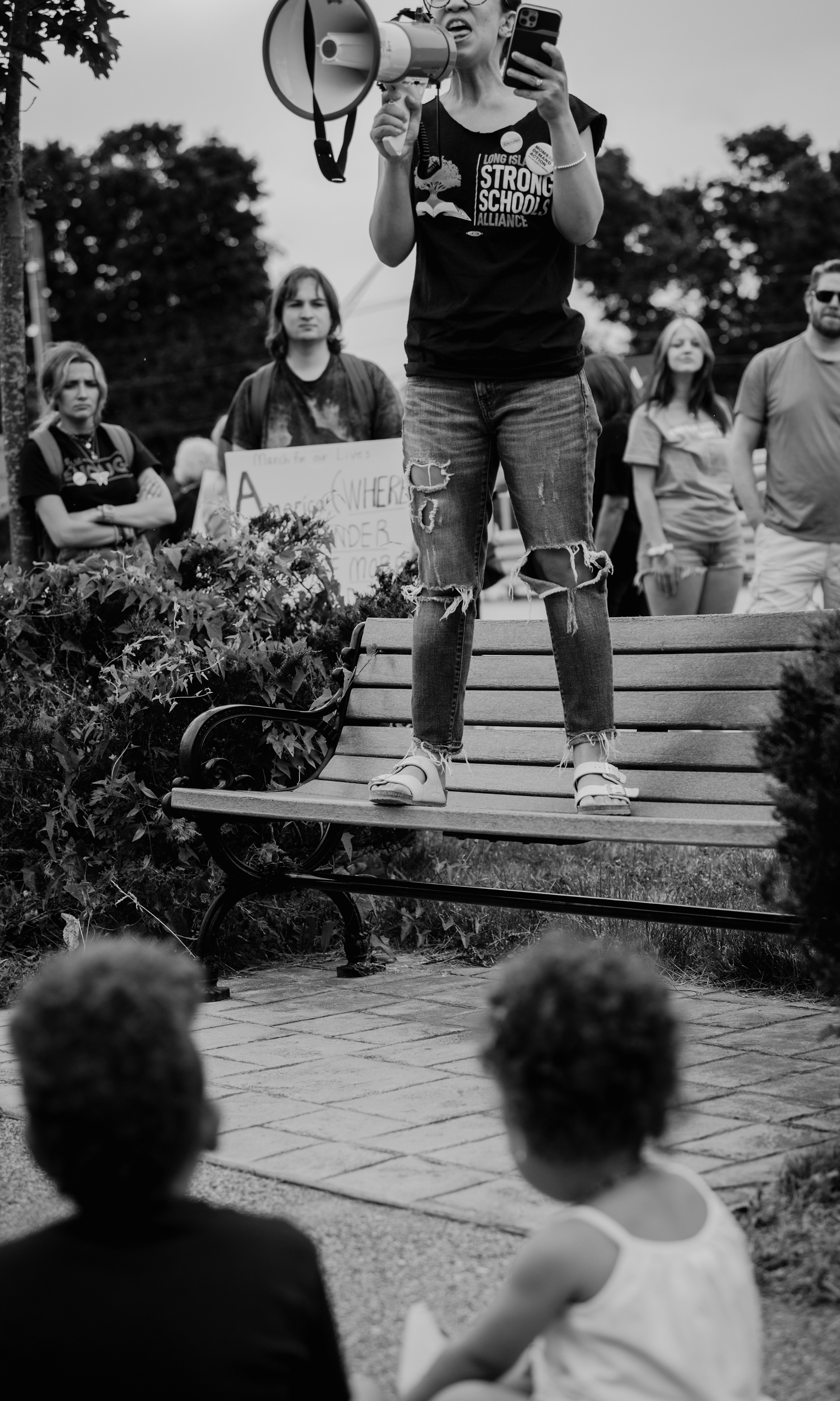 While her children look on in admiration, a mother passionately speaks her mind during an organized rally calling an end to gun violence held at “Resistance Corner” in Port Jefferson Station, NY.
