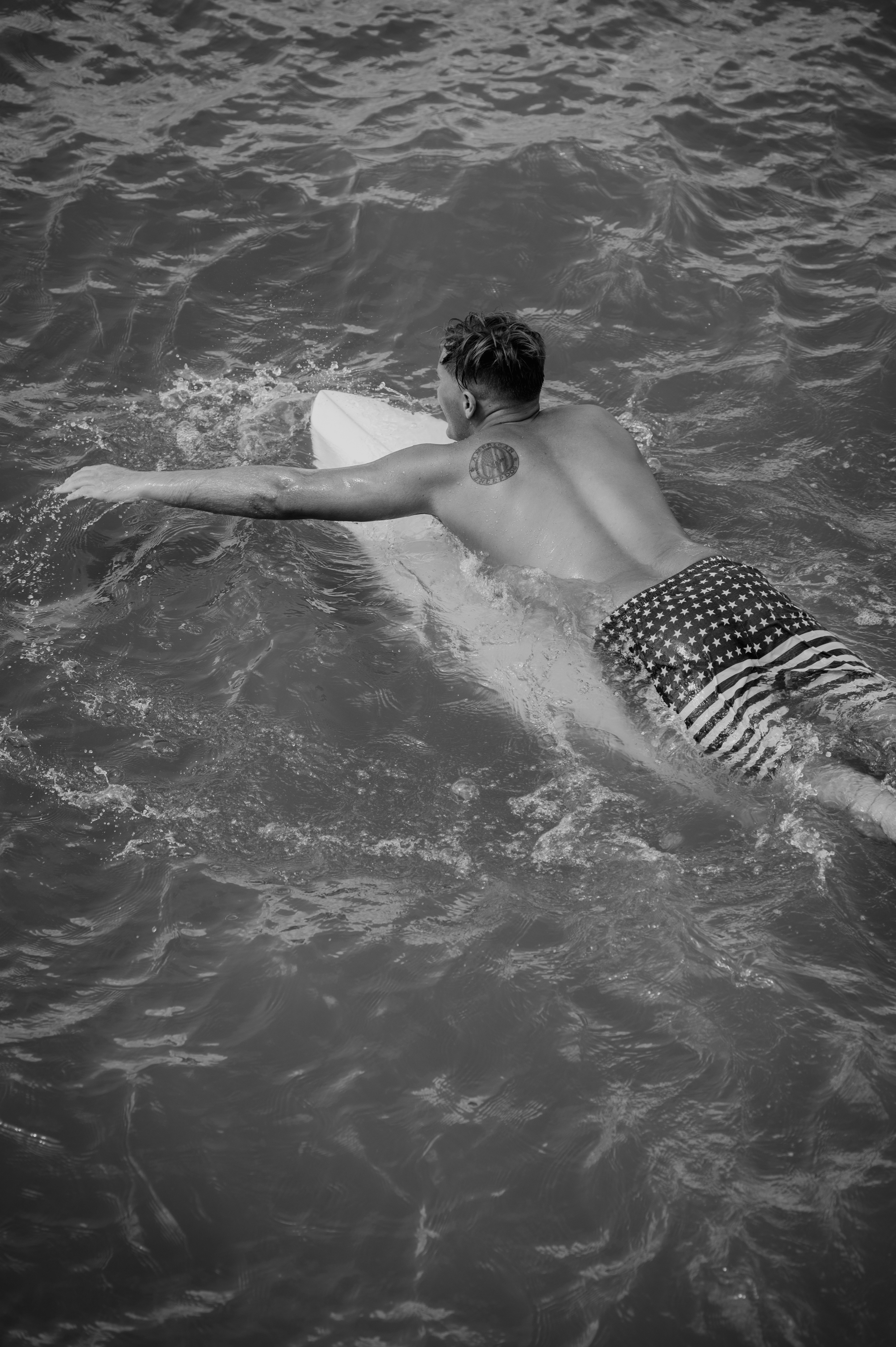 Surfers joined one another in the waters surrounding the Bogue Inlet Fishing Pier in Emerald Isle, NC, to catch some of the late-summer waves.