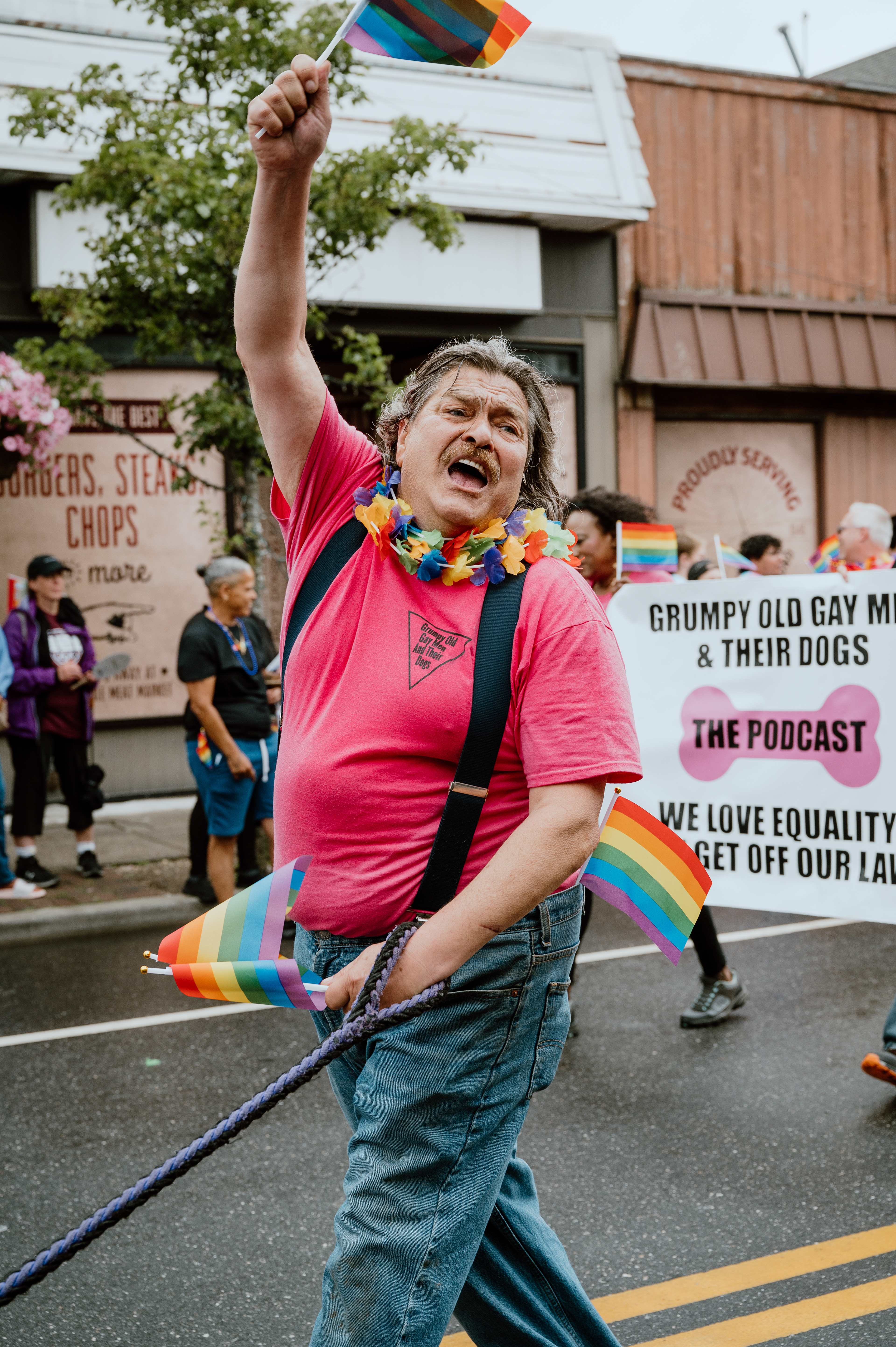 A man representing the “Grumpy Old Gay Men & Their Dogs” podcast demonstrates his sense of pride during the Long Island Pride Parade held in Farmingdale, NY on June 12, 2022. 