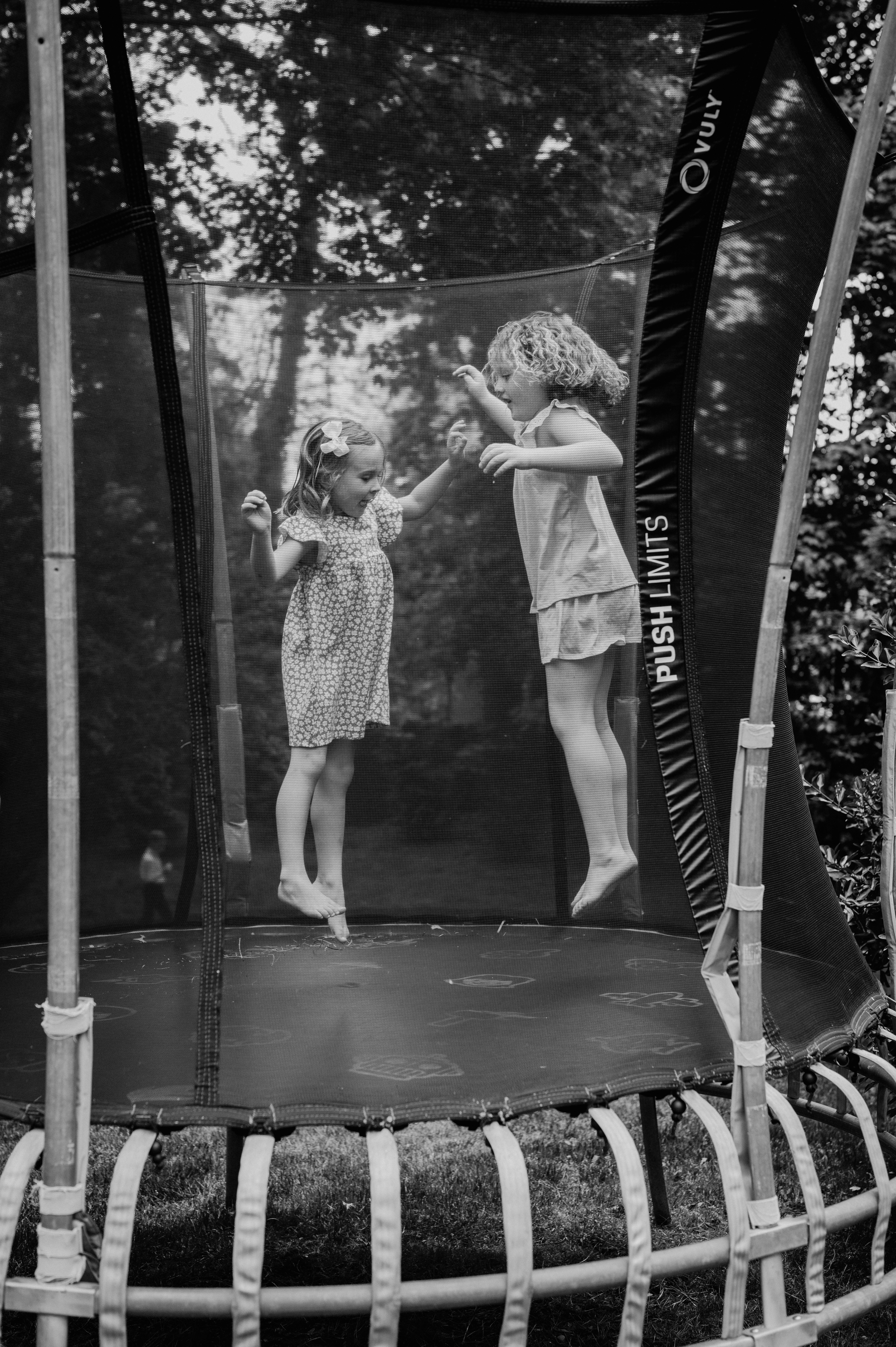 Children share a moment of outdoor joy. Captured on May 14, 2022. 