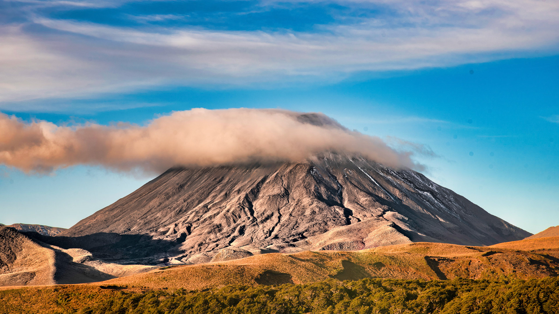 Mount Ngauruhoe is an active stratovolcano in New Zealand. It is the youngest vent in the Tongariro volcanic complex on the Central Plateau of the North Island and first erupted about 2,500 years ago. Although often regarded as a separate mountain, geologically, it is a secondary cone of Mount Tongariro.