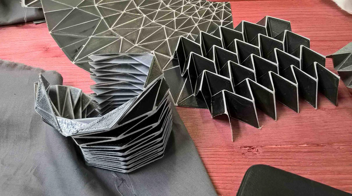 Prototypes and demonstration objects of folded origami structures made of textile and 3D print by Kristina Wißling at the Ars Electronica Festival in Linz.