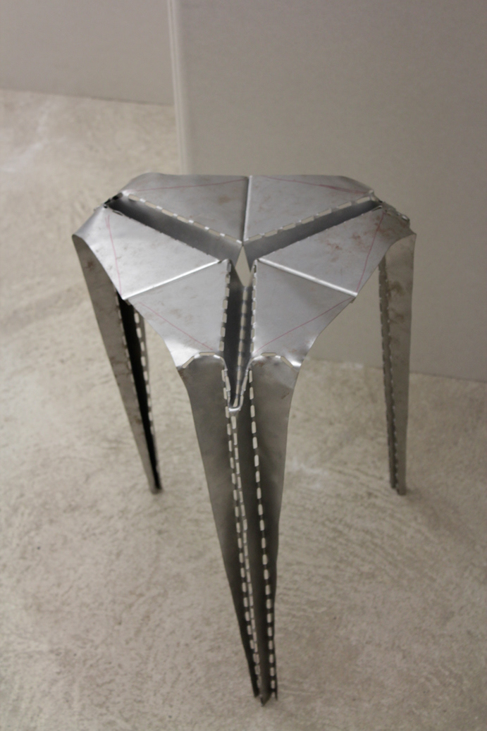 Student work of a chair using folding techniques - prototype made of metal.