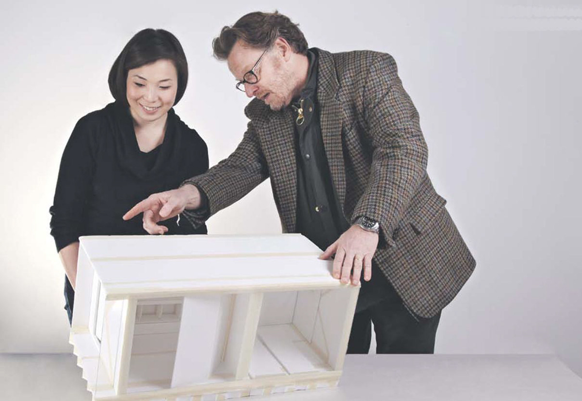 Professor and student presenting the results of the foldable paper emergency shelters.