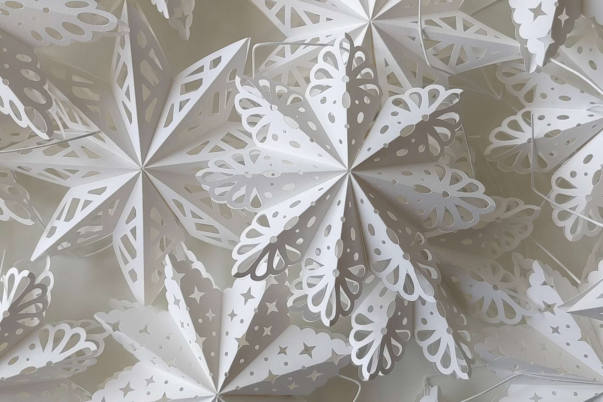 Foldable snowflake ornaments, handcrafted decoration in different designs.