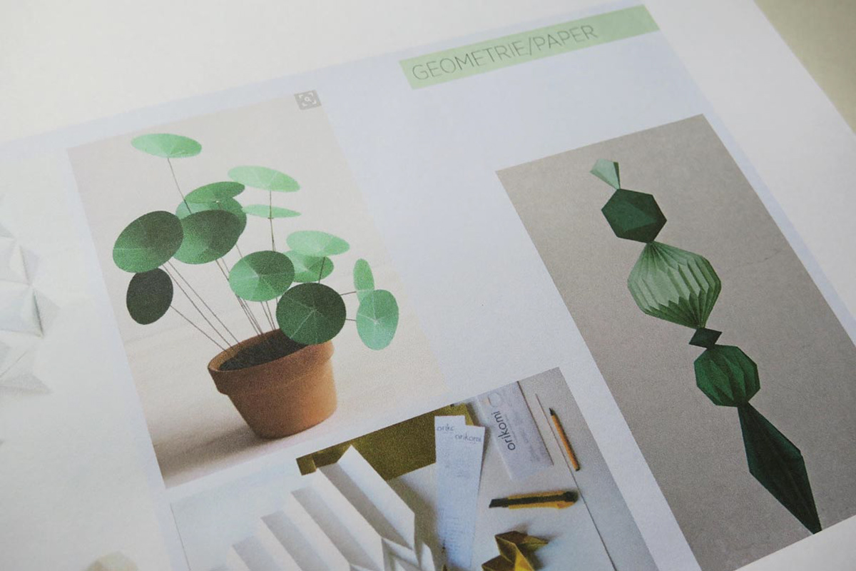Mood boards with paper and origami folding techniques for inspiration.