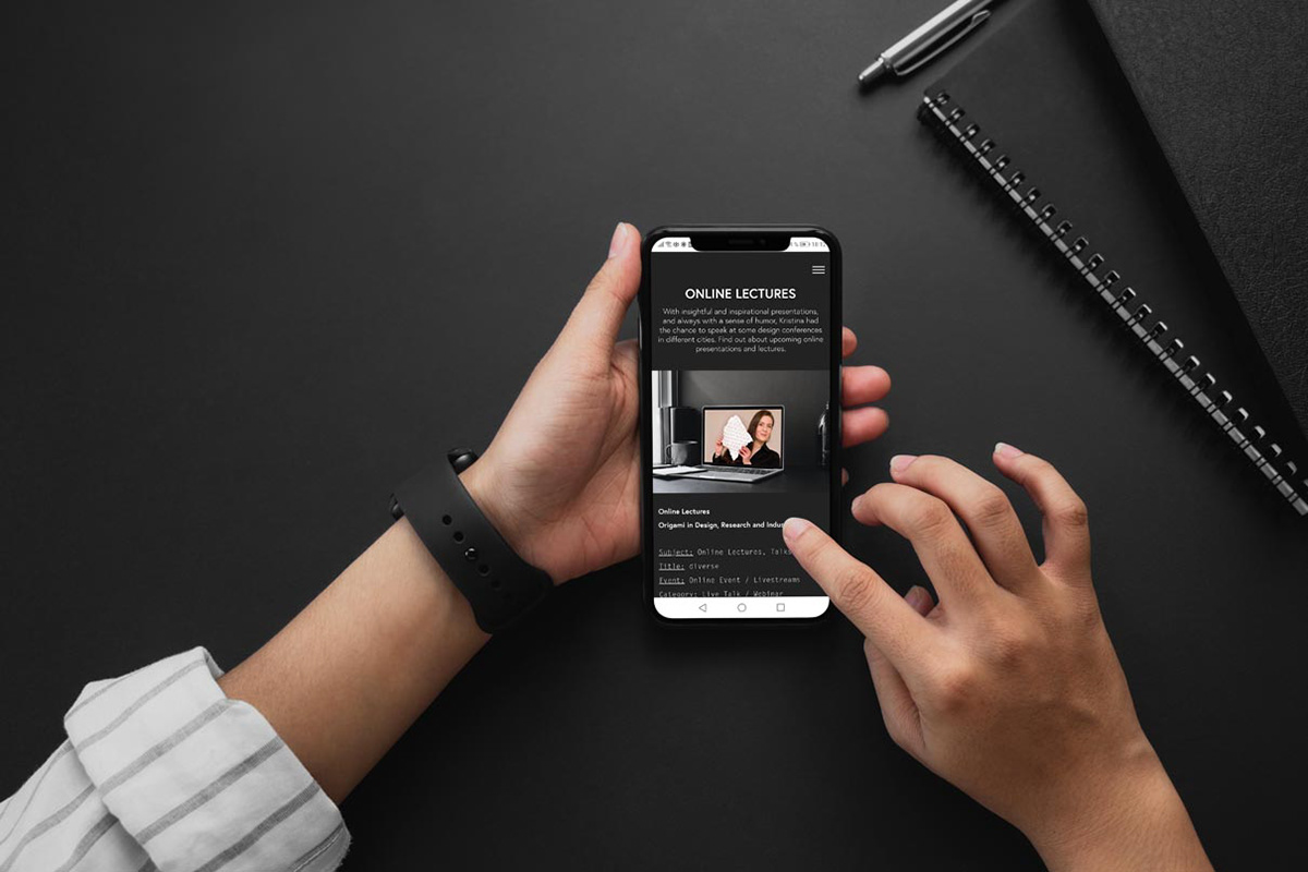 Hand with smartphone to join the origami digital newsletter by Kristina Wißling.