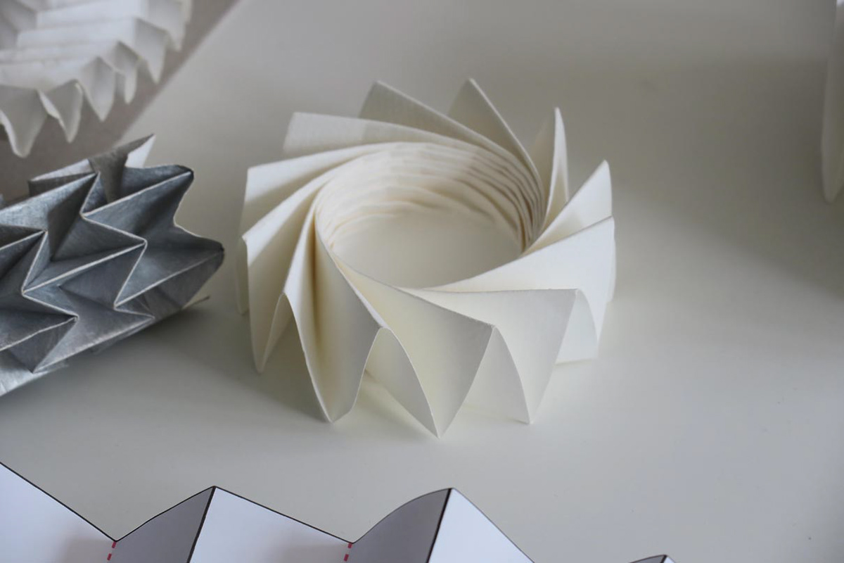 Paper models of twister folds used in aerospace.