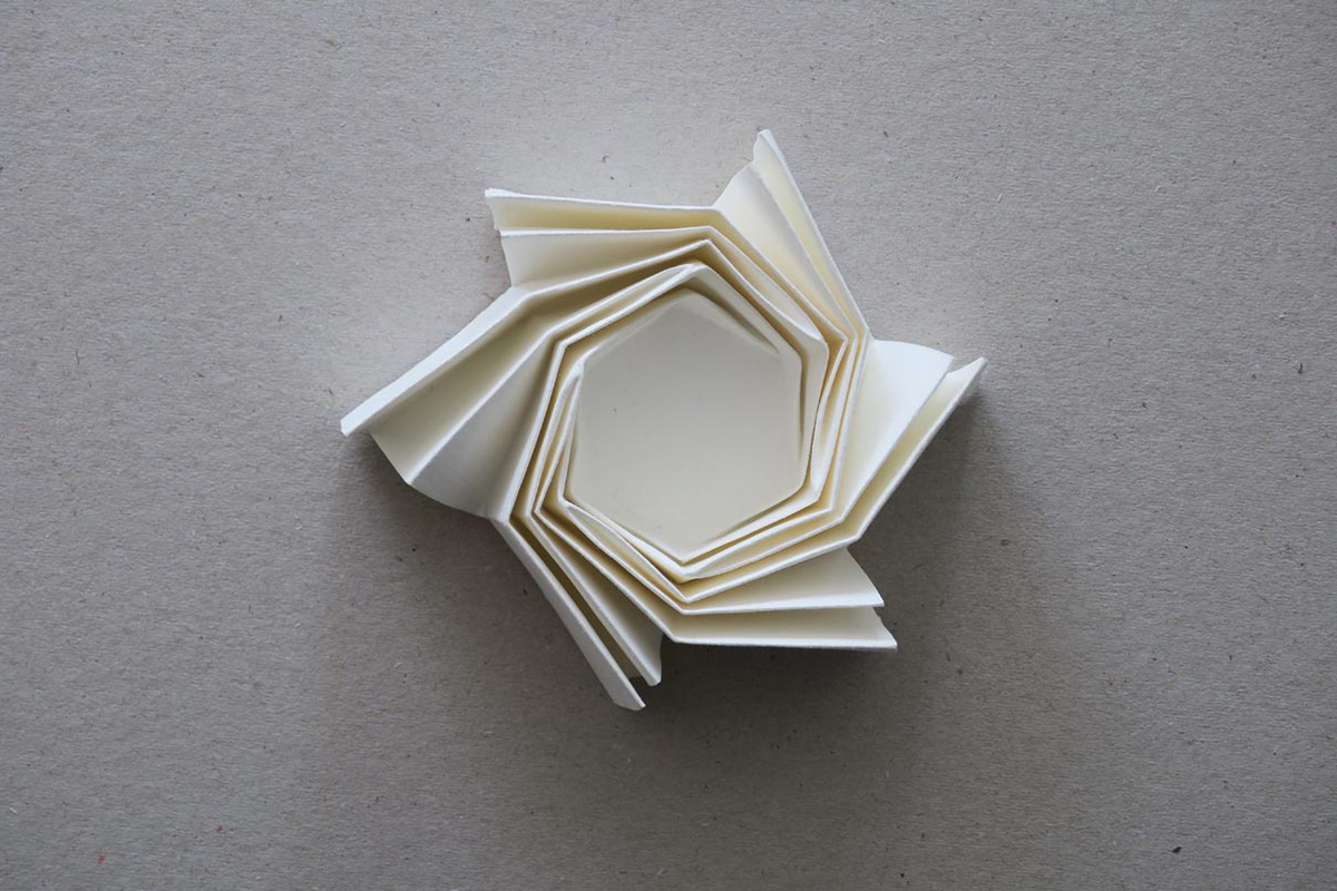 Paper models of twister folds used in aerospace.
