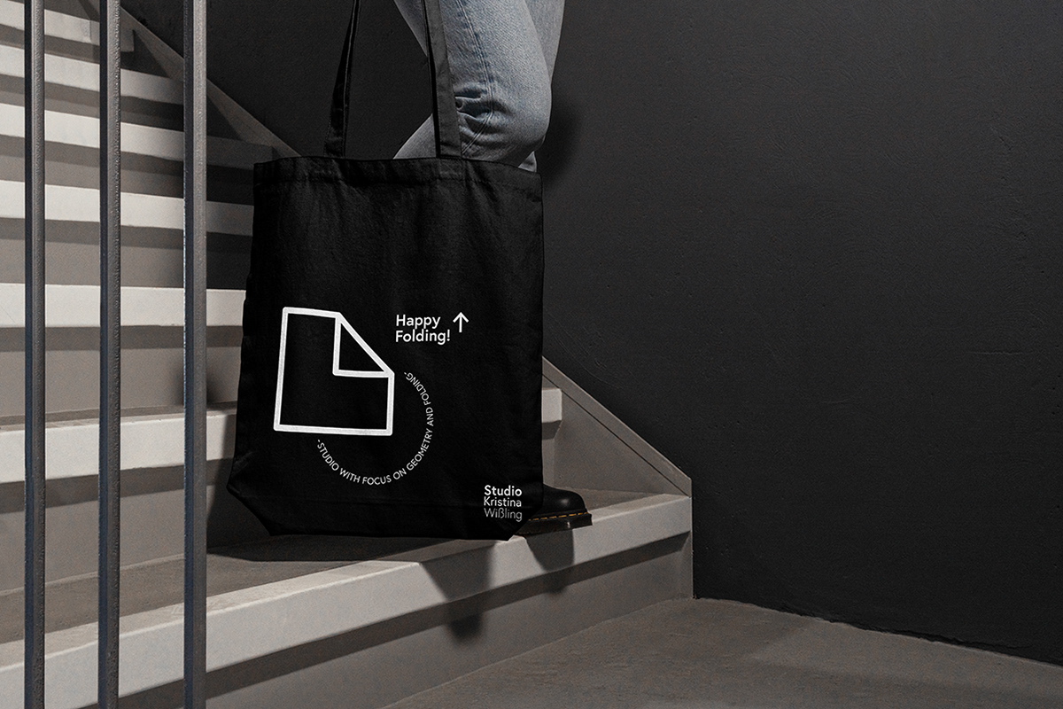 Black linen bag with workshop materials and giveaways from designer Kristina Wißling.
