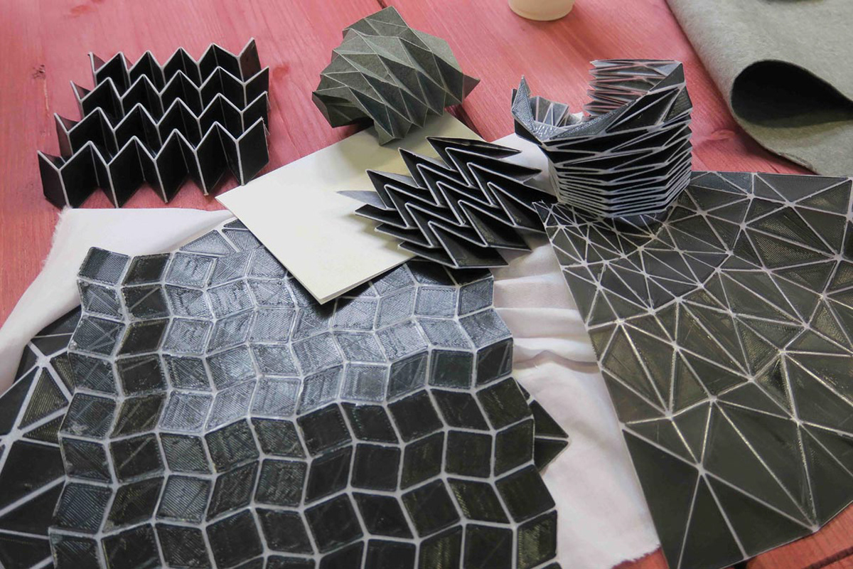 Prototypes and demonstration objects of folded origami structures made of textile and 3D print by Kristina Wißling at the Ars Electronica Festival in Linz.