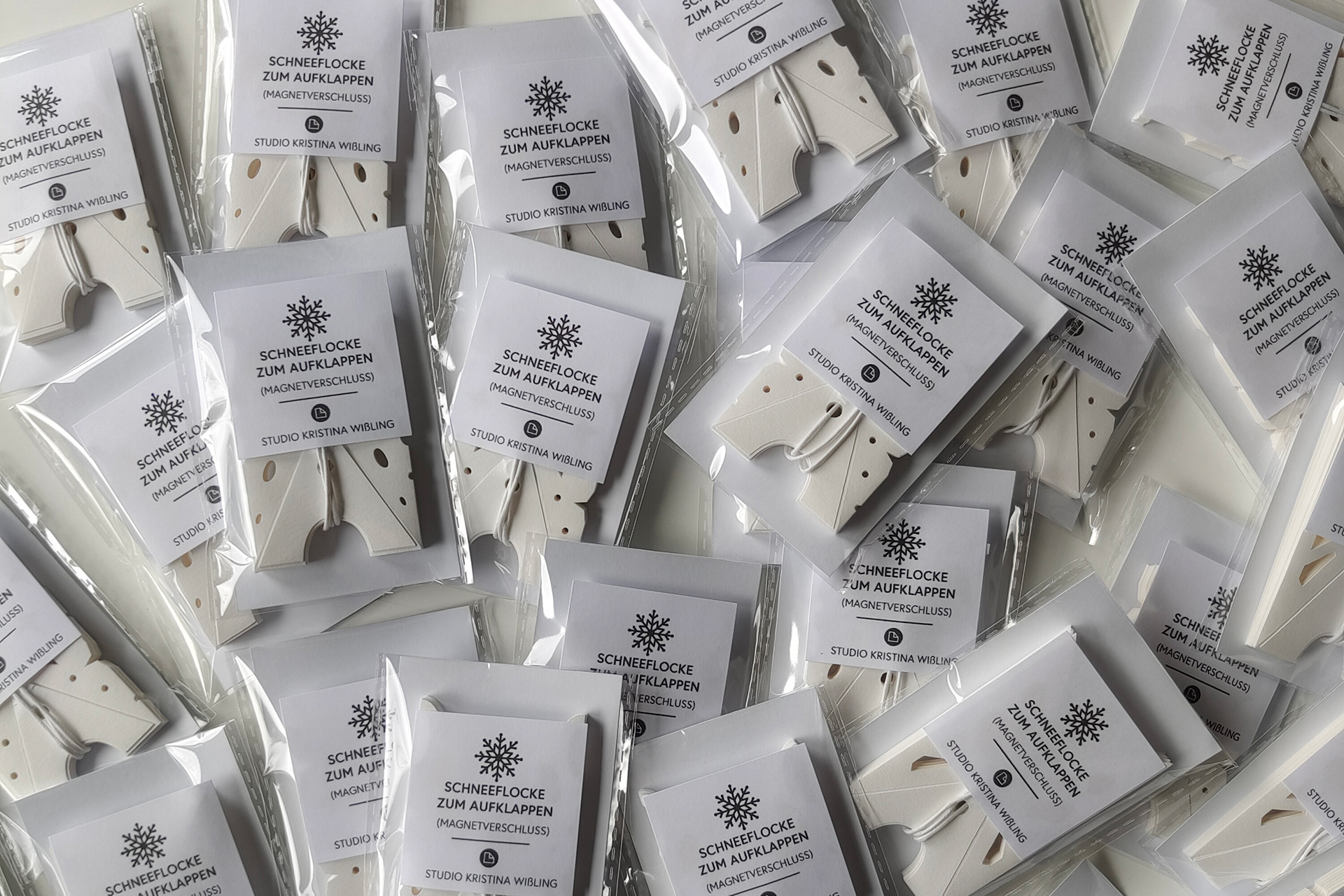 Handmade snowflake ornaments in transparent packaging. Perfect as a gift or to decorate your home and bring Christrmas sparkle to your room.