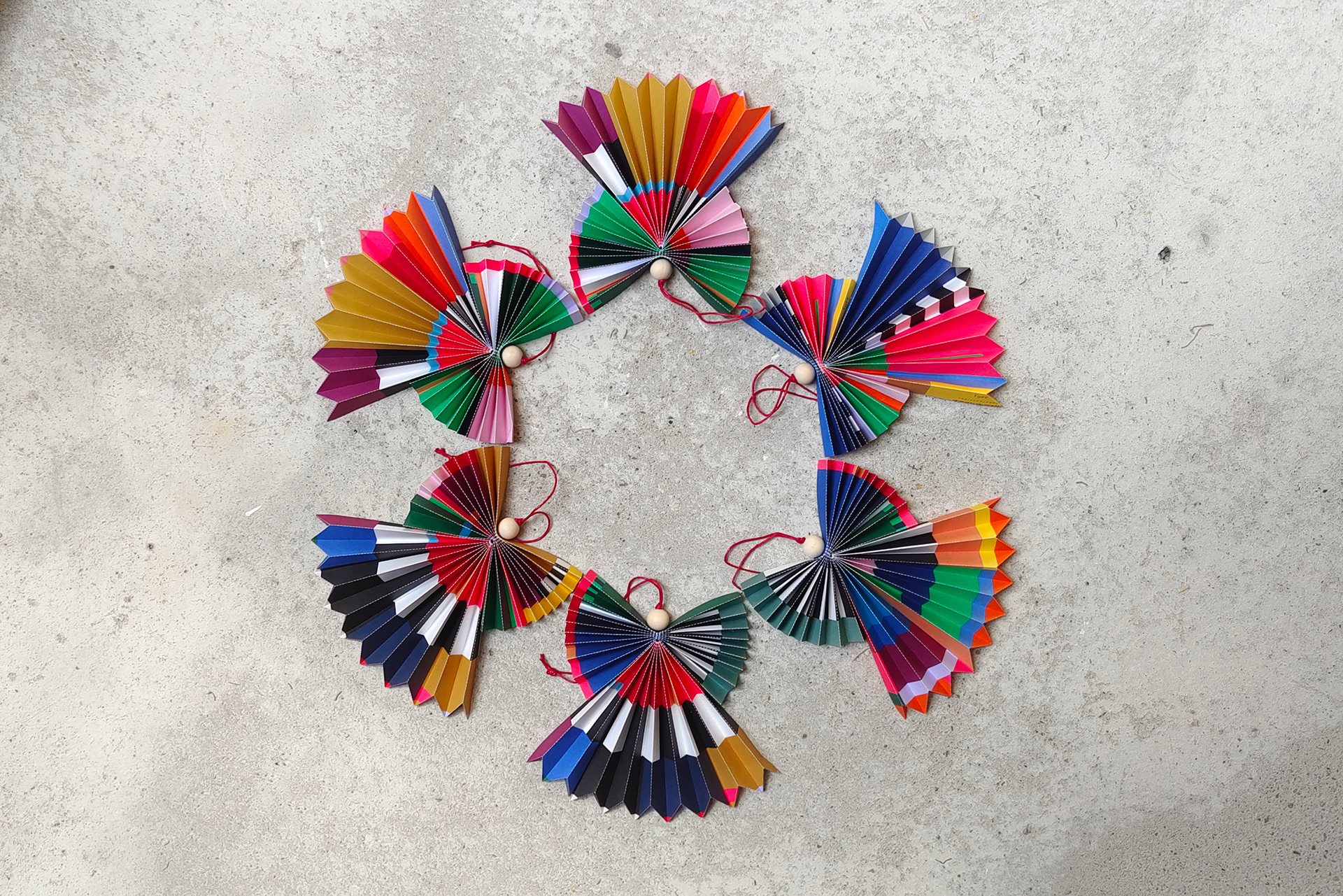 Paper angels in pleated folding technique, designed and folded by hand in Germany.
